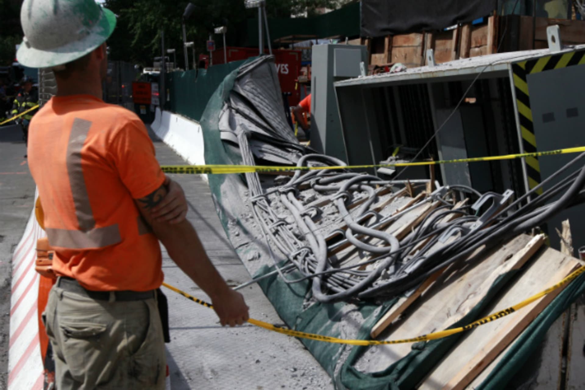 <p>Construction workers look over the damage following a blast at the 72nd Street construction site of the Second Avenue subway line in Manhattan on August 21, 2012 (Brendan McDermid/Courtesy Reuters).</p>
