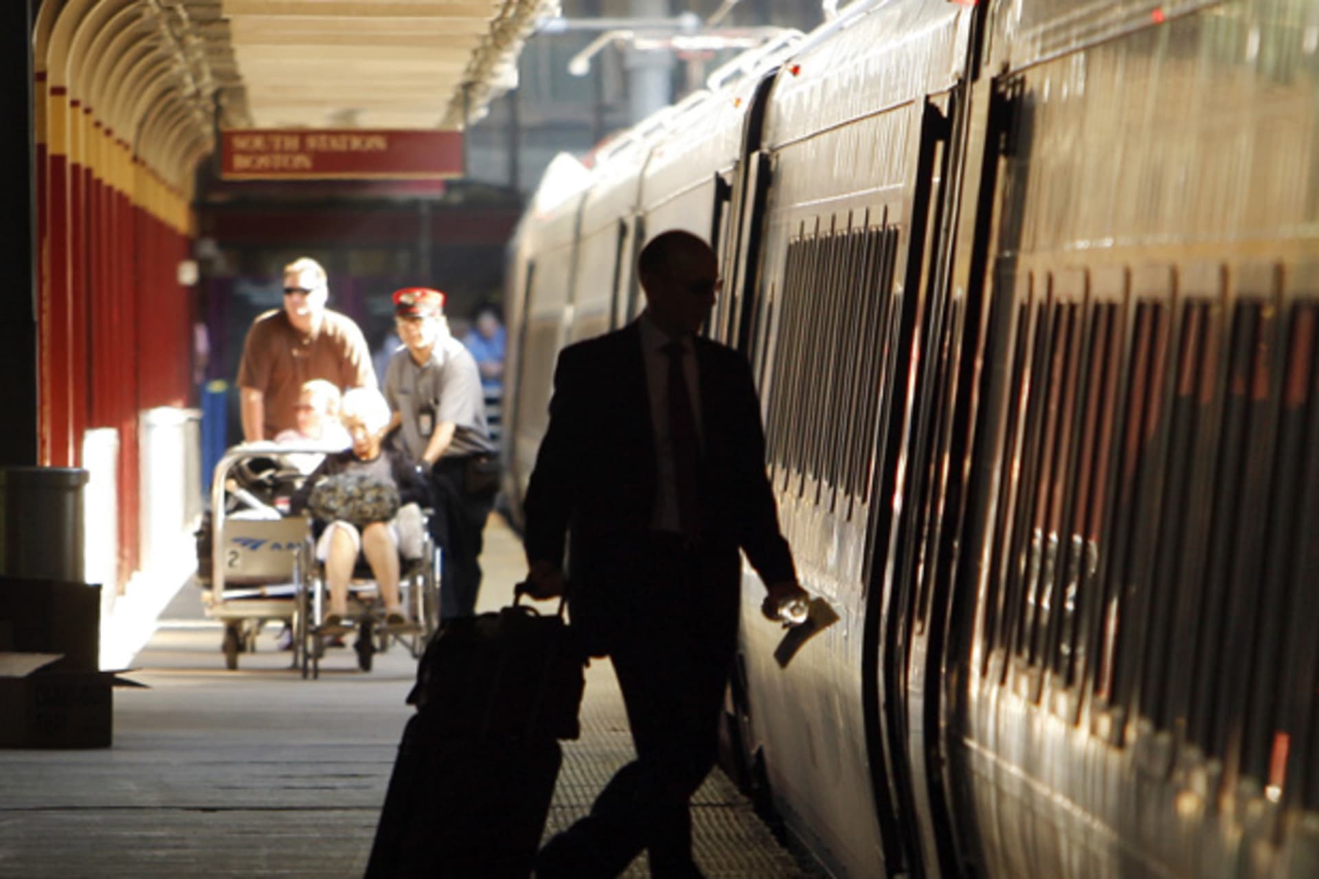 <p>Passengers board an Amtrak Acela Express train at South Station in Boston (Brian Snyder/Courtesy Reuters).</p>
