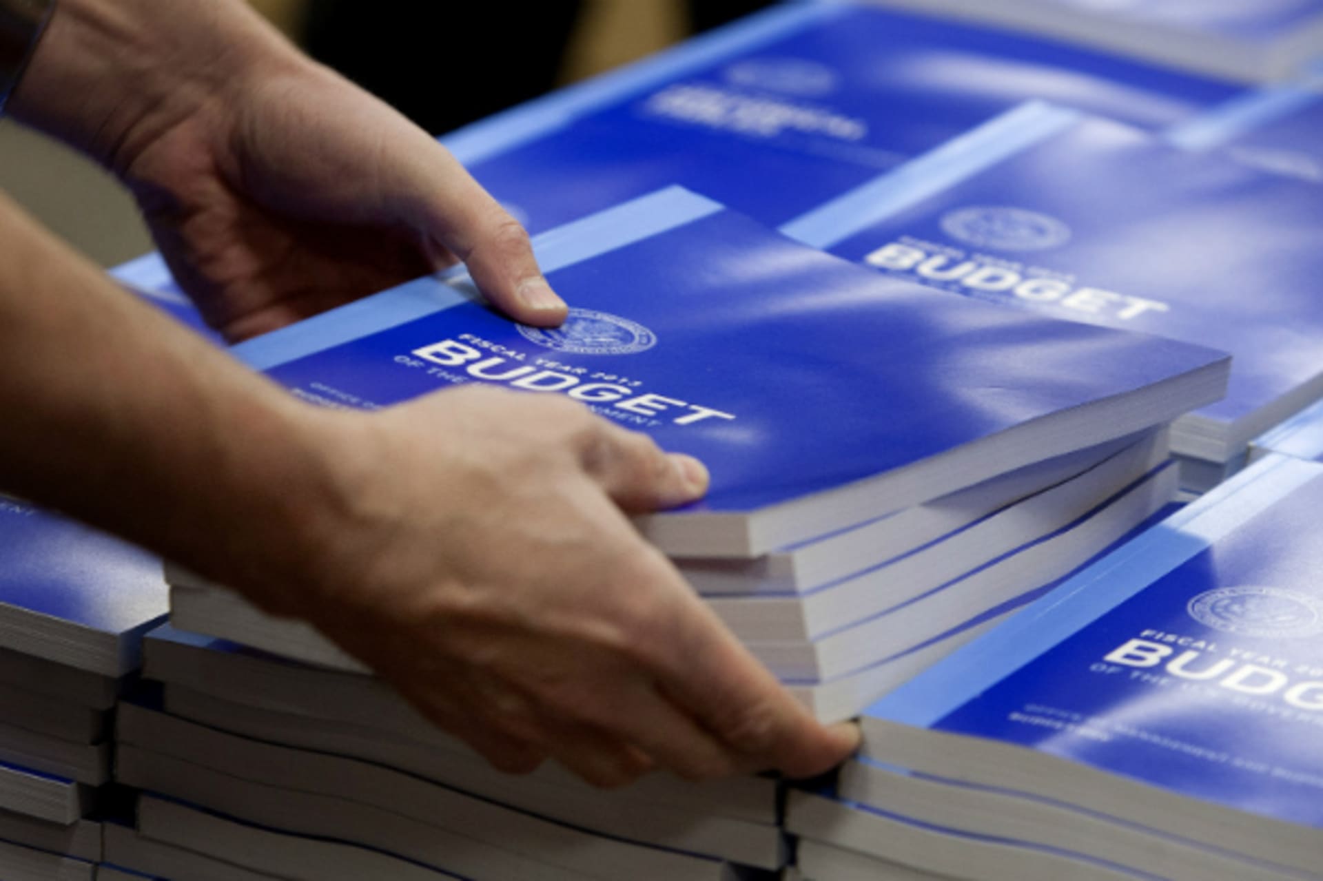 <p>An employee at the federal government’s printing office stacks copies of the 2013 budget (Joshua Roberts/Courtesy Reuters).</p>

