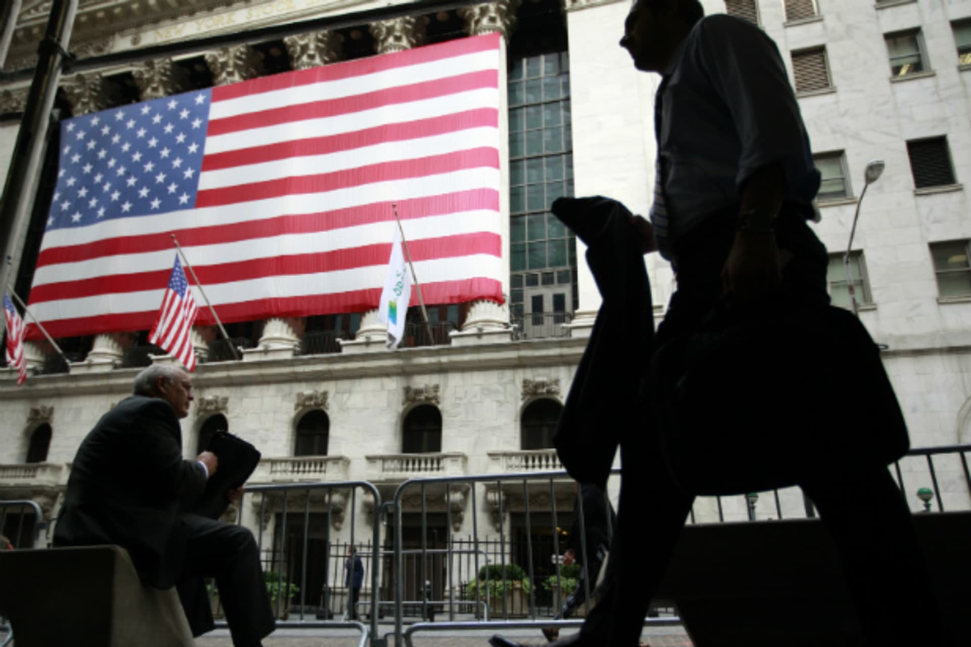 <p>Morning commuters stroll past the New York Stock Exchange (Brendan McDermid/Courtesy Reuters).</p>
