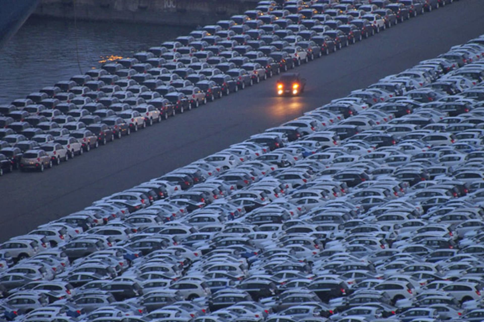 <p>A truck is driven at a yard where cars are parked before being exported at a port in Incheon, Korea (Choi Dae-woong/Courtesy Reuters).</p>
