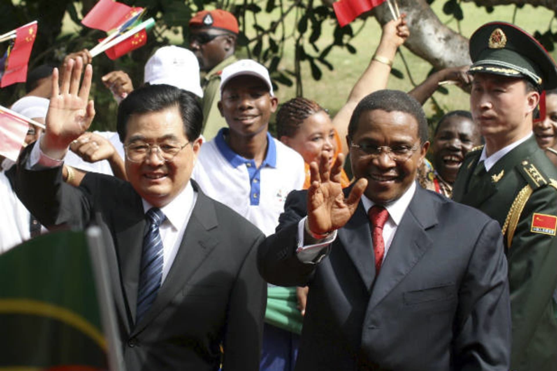 <p>China’s President Hu Jintao (L) and his Tanzanian counterpart Jakaya Kikwete wave to a crowd upon their arrival at the State House in Dar es Salaam, Tanzania on February 15, 2009 (Courtesy Reuters).</p>
