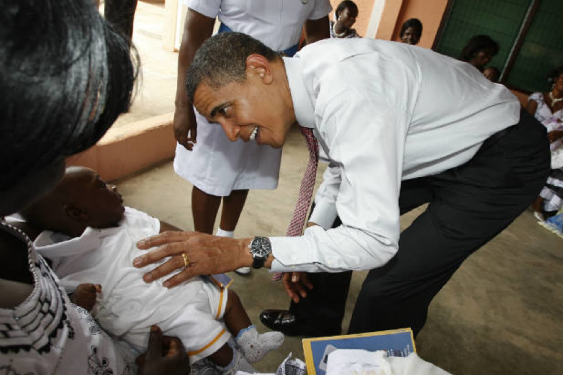 <p>President Barack Obama greets a baby as he visits a hospital in Accra, Ghana on July 11, 2009 (Jason Reed/Courtesy Reuters).</p>
