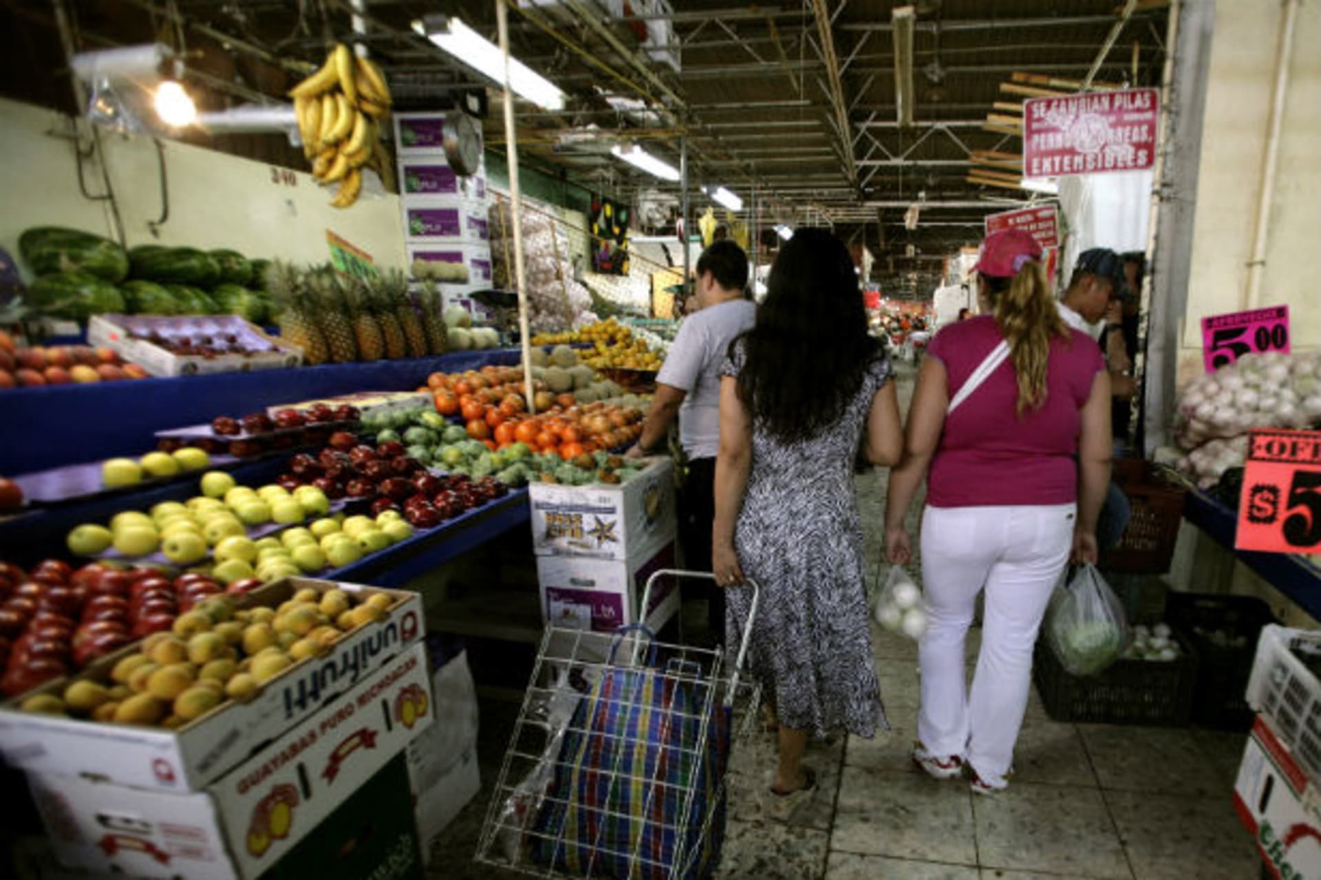 <p>Yolanda Guzman and her daughter leave Mexico City’s Martinez de la Torre Market</p>
