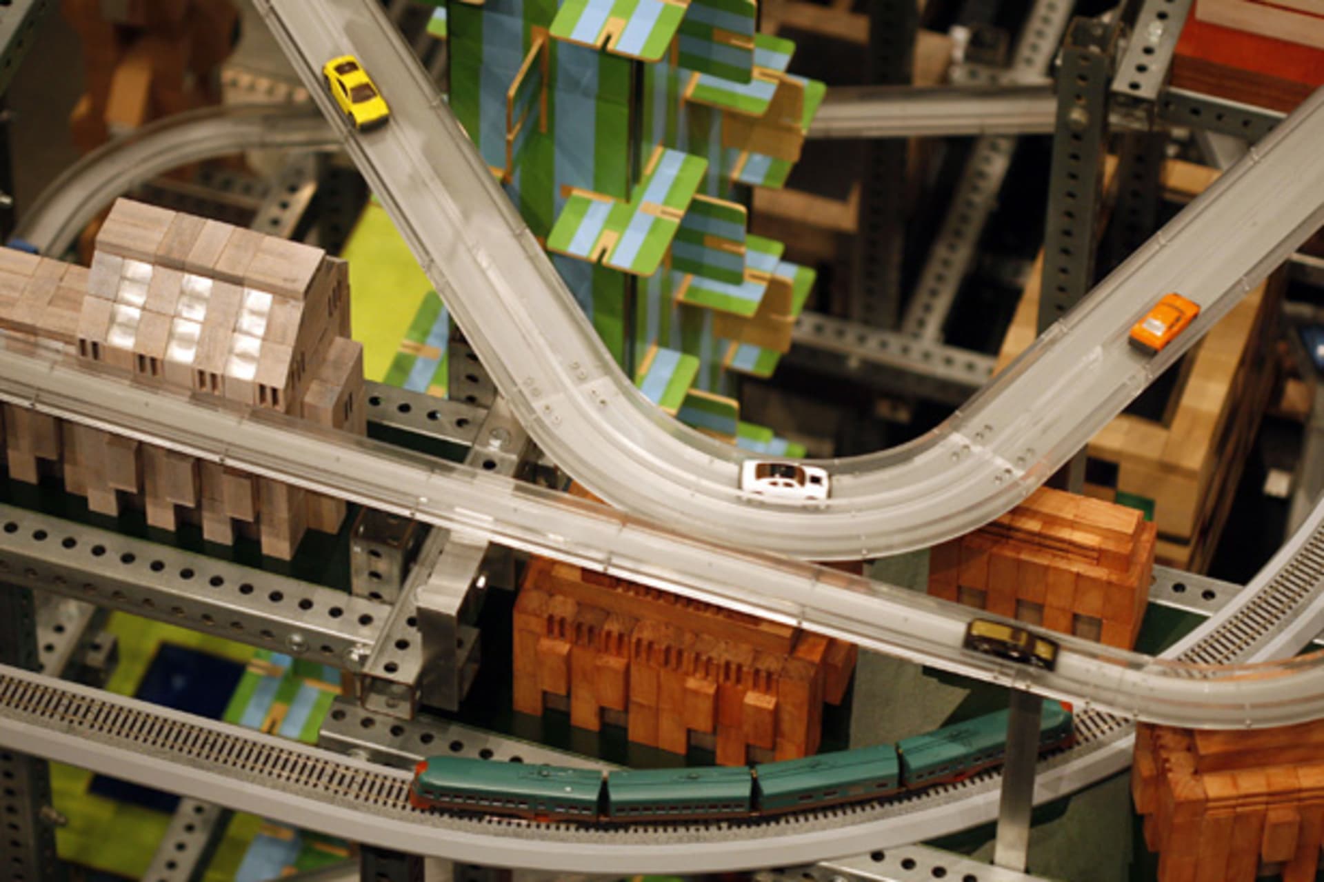 <p>Miniature cars move along an elevated freeway of a large-scale kinetic sculpture meant to symbolize a miniature city at the Los Angeles County Museum of Art (David McNew/Courtesy Reuters).</p>