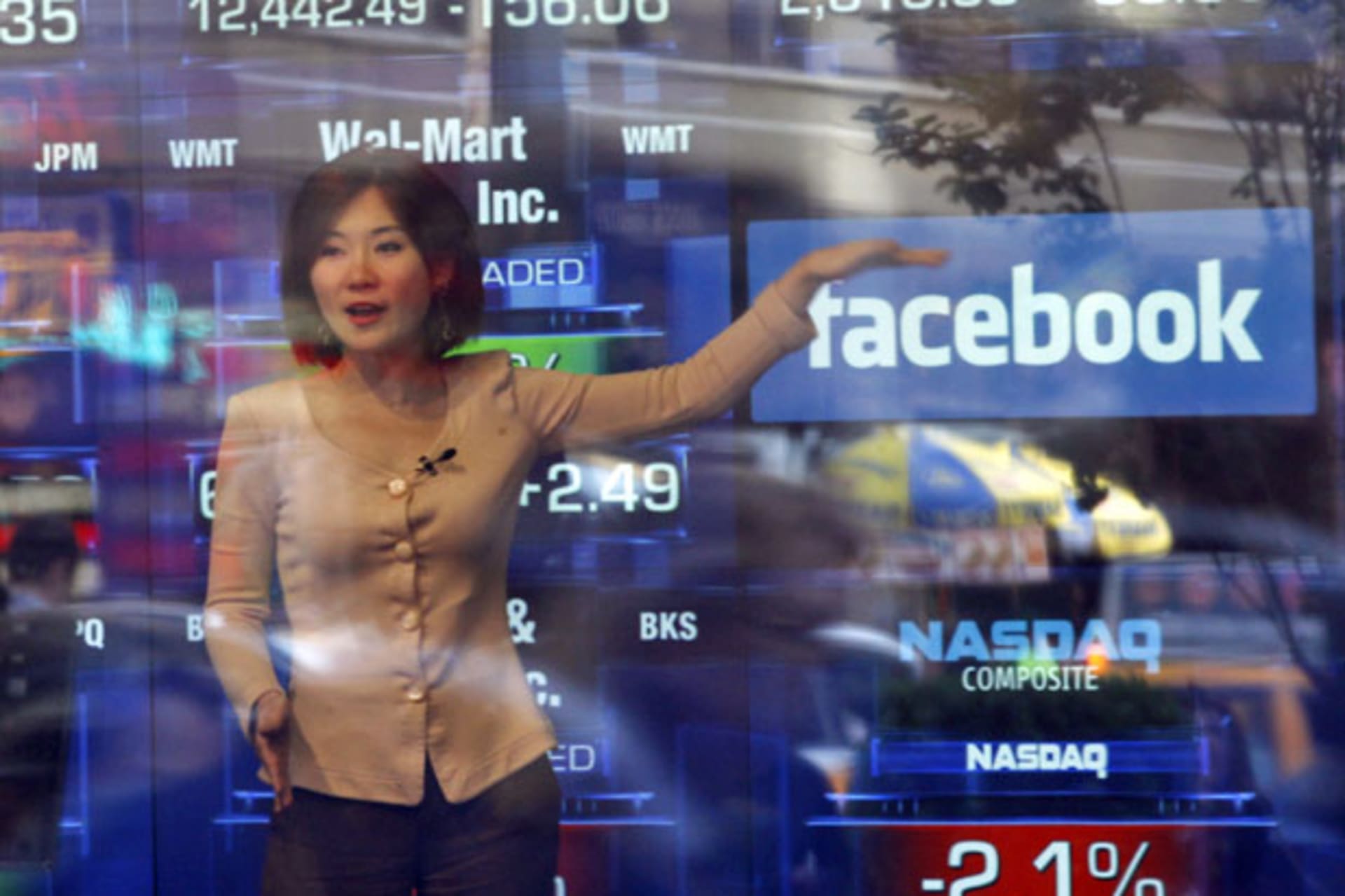 <p>A television reporter talks about the Facebook IPO at the NASDAQ Marketsite in New York on May 17, 2012 (Keith Bedford/Courtesy Reuters).</p>