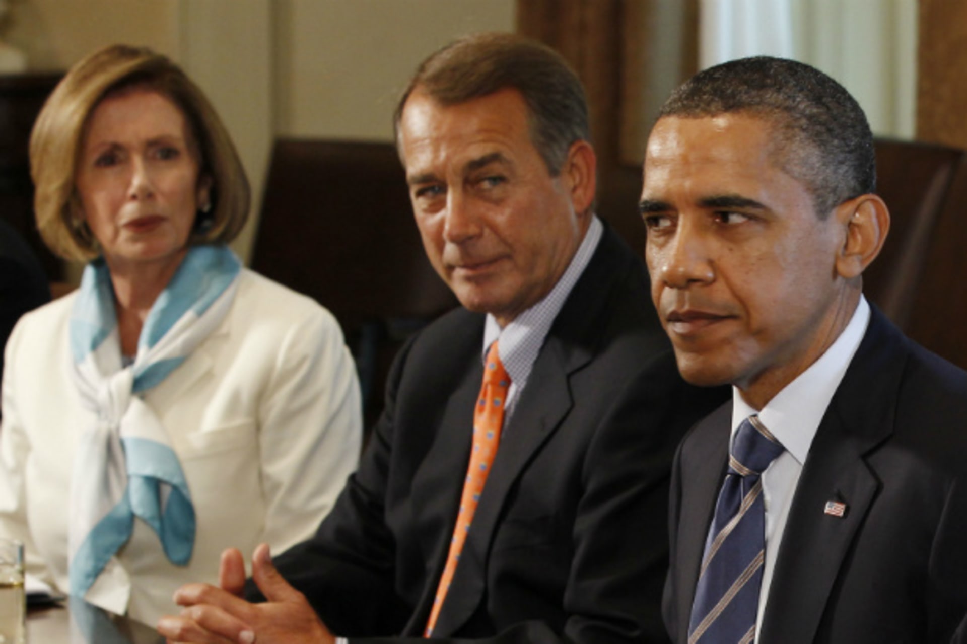 <p>President Obama, Speaker John Boehner, and House Democratic Leader Pelosi meet to discuss the debt ceiling in July 2011. (Larry Downing/Courtesy Reuters)</p>
