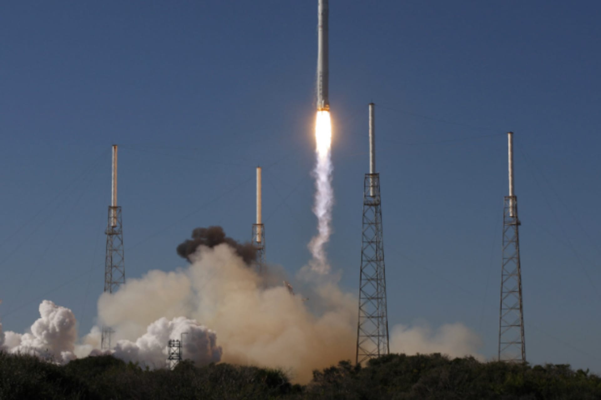 <p>SpaceX’s Falcon 9 rocket with a Dragon capsule lifts off from Cape Canaveral for a test flight in 2010. (Scott Audette/Courtesy Reuters)</p>
