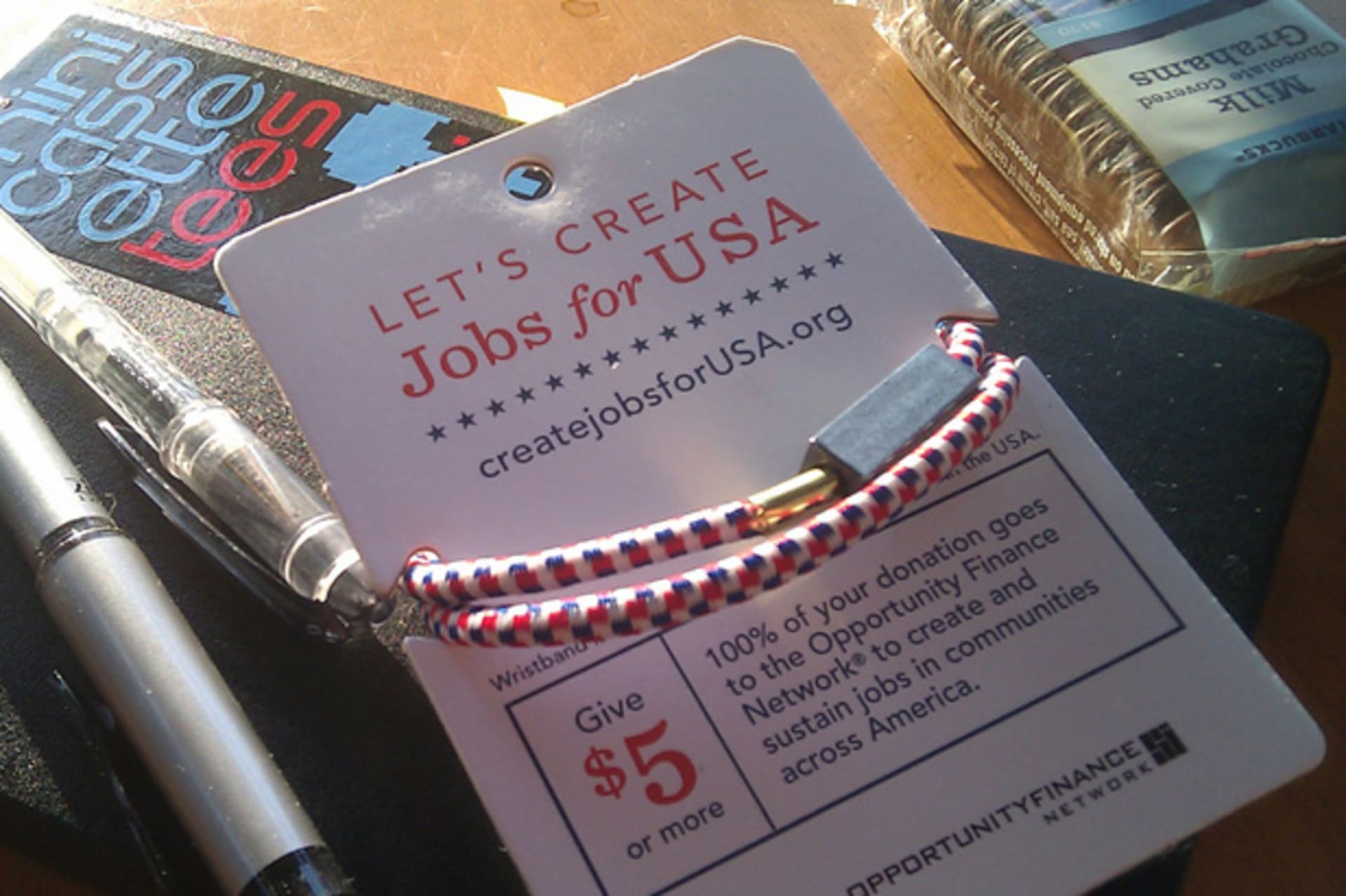 <p>Starbucks “Create Jobs for USA” wristband. (seanmcmenemy/flickr)</p>
