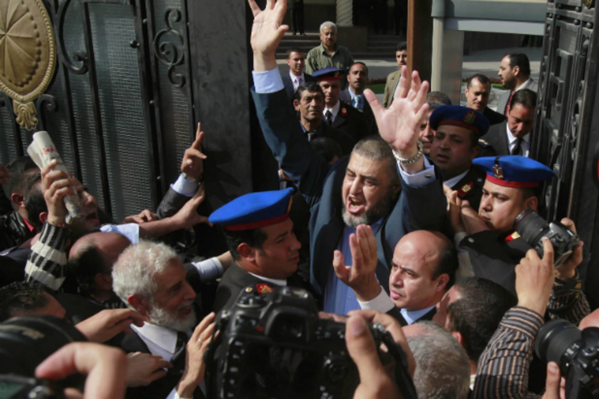 <p>Presidential candidate from the Muslim Brotherhood, and the Freedom and Justice Party (FJP) Khairat al-Shater waves to his sup…ts to the Higher Presidential Elections Commission (HPEC) headquarters in Cairo April 5, 2012. (Courtesy REUTERS/Asmaa Waguih)</p>
