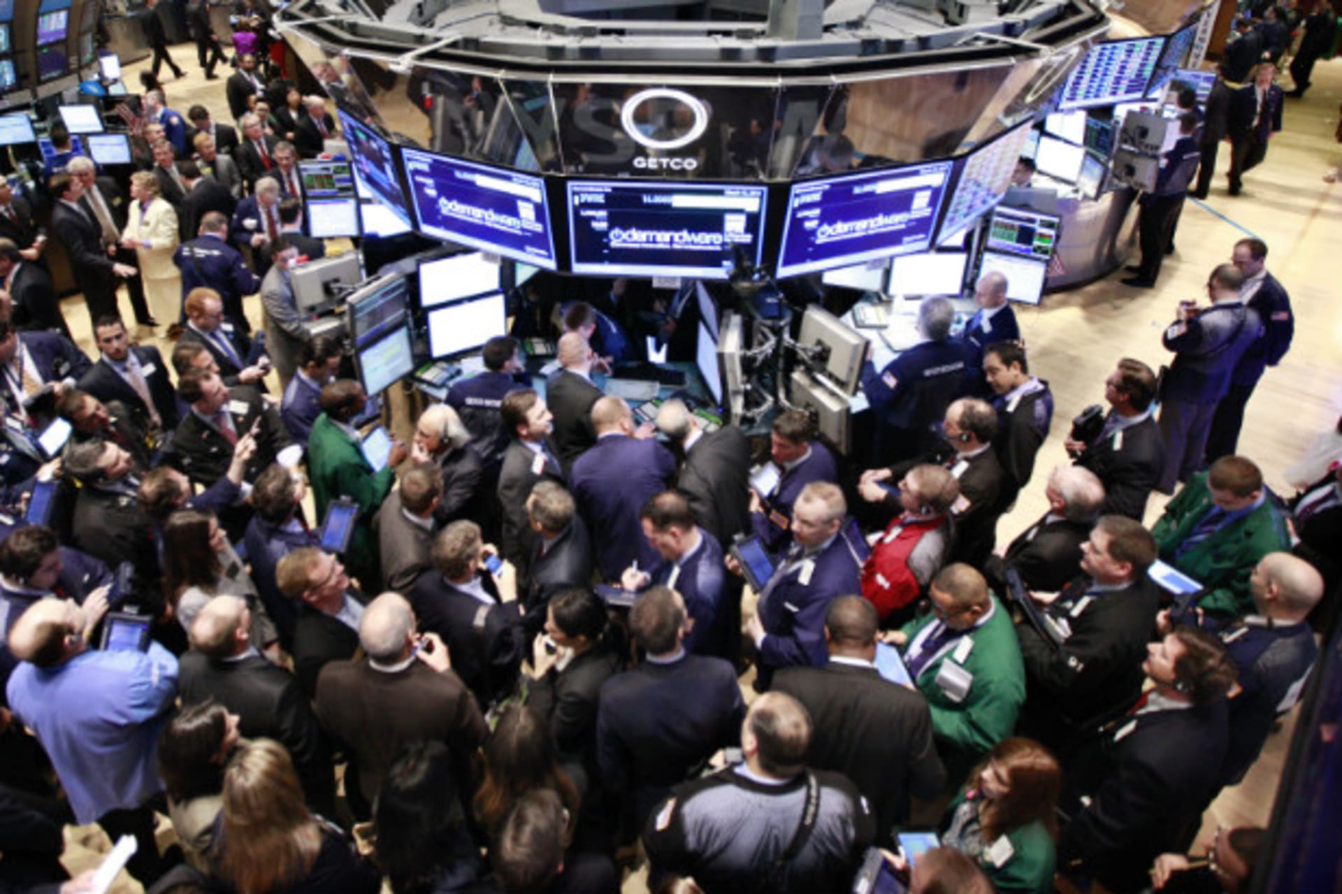 <p>Traders gather on the floor of the New York Stock Exchange for Demandware’s IPO on March 15, 2012. (Brendan McDermid/Courtesy Reuters)</p>
