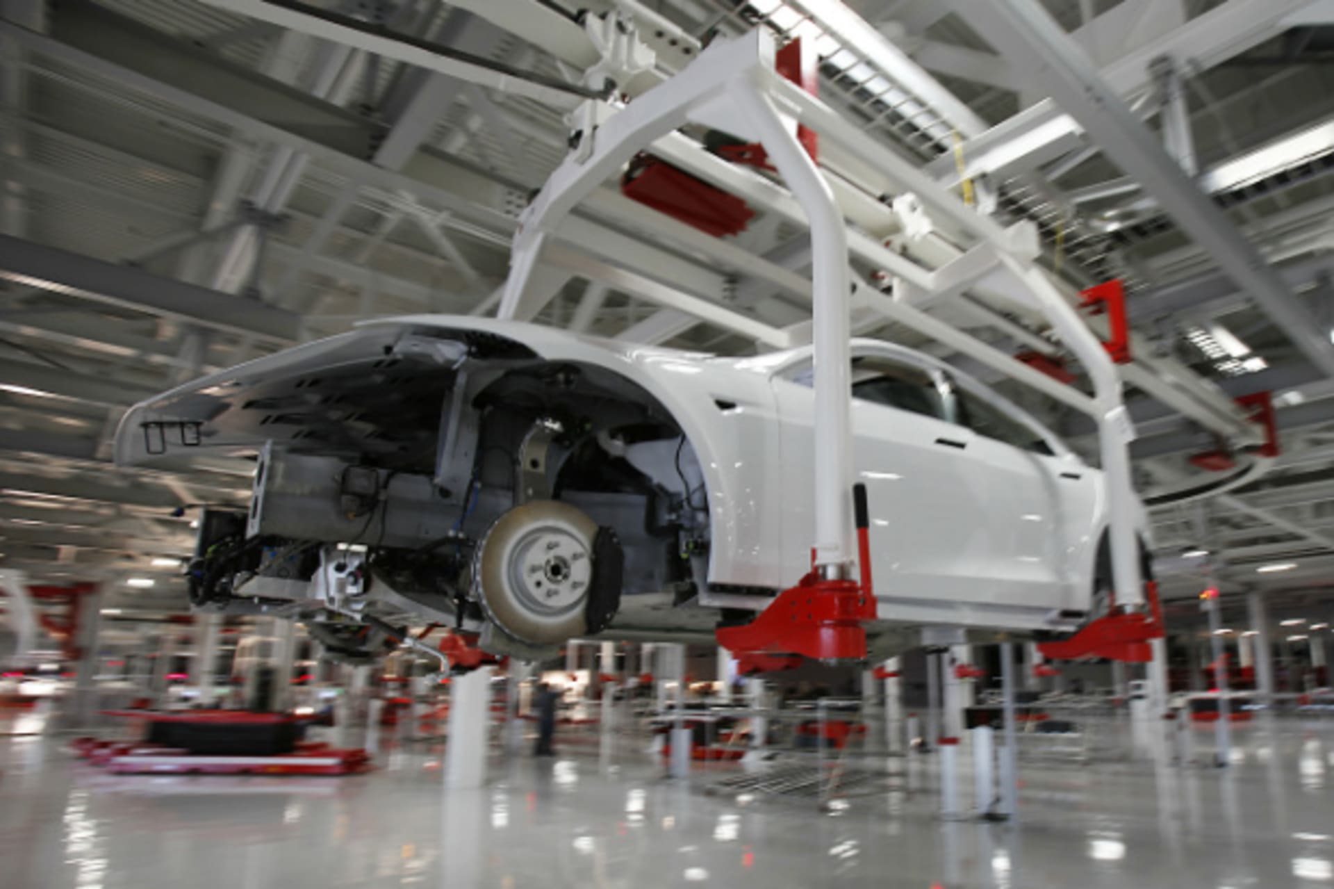 <p>A Tesla Motors Model S is undergoing assembly at a Fremont, California factory—formerly co-owned by GM and Toyota—that Tesla purchased with the proceeds of a $465 million DoE loan. (Stephen Lam/Courtesy Reuters)</p>
