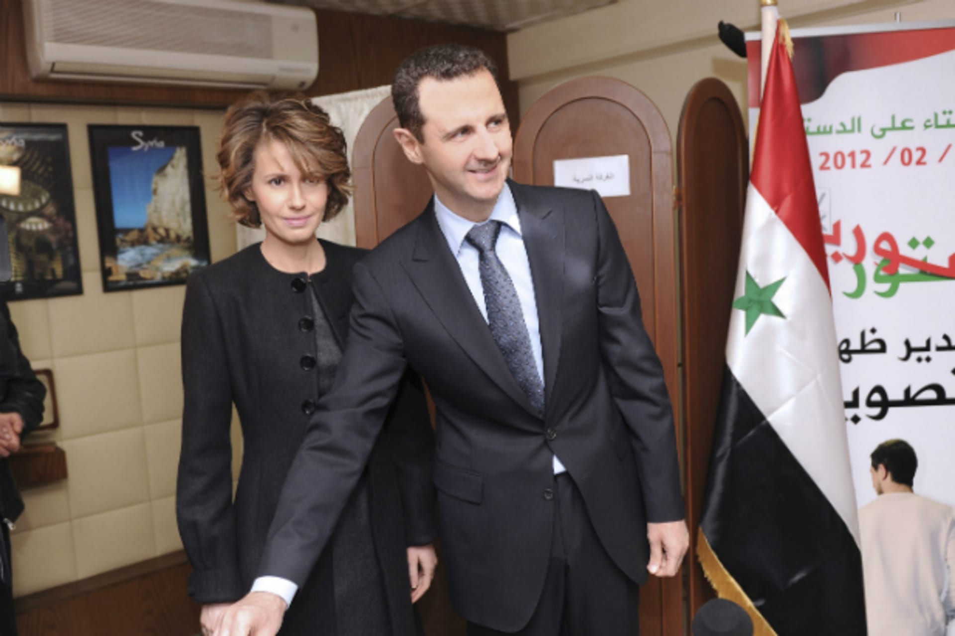 <p>Syria’s President Bashar al-Assad and his wife Asma vote during a referendum on a new constitution at a polling station in a Syrian TV station building in Damascus February 26, 2012. (Courtesy REUTERS/SANA)</p>
