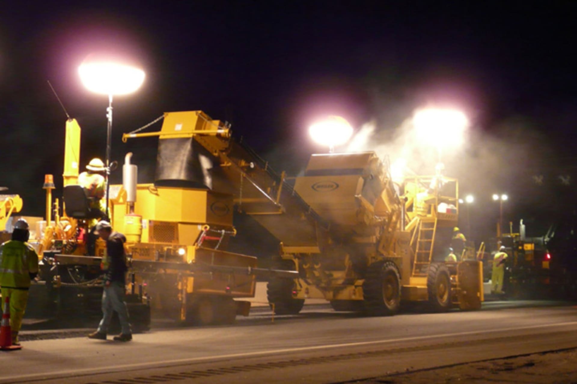 <p>Employees of Pike Industries work at night paving a portion of Route 101 in Exeter, New Hampshire (Pike Industries Handout/Courtesy Reuters).</p>
