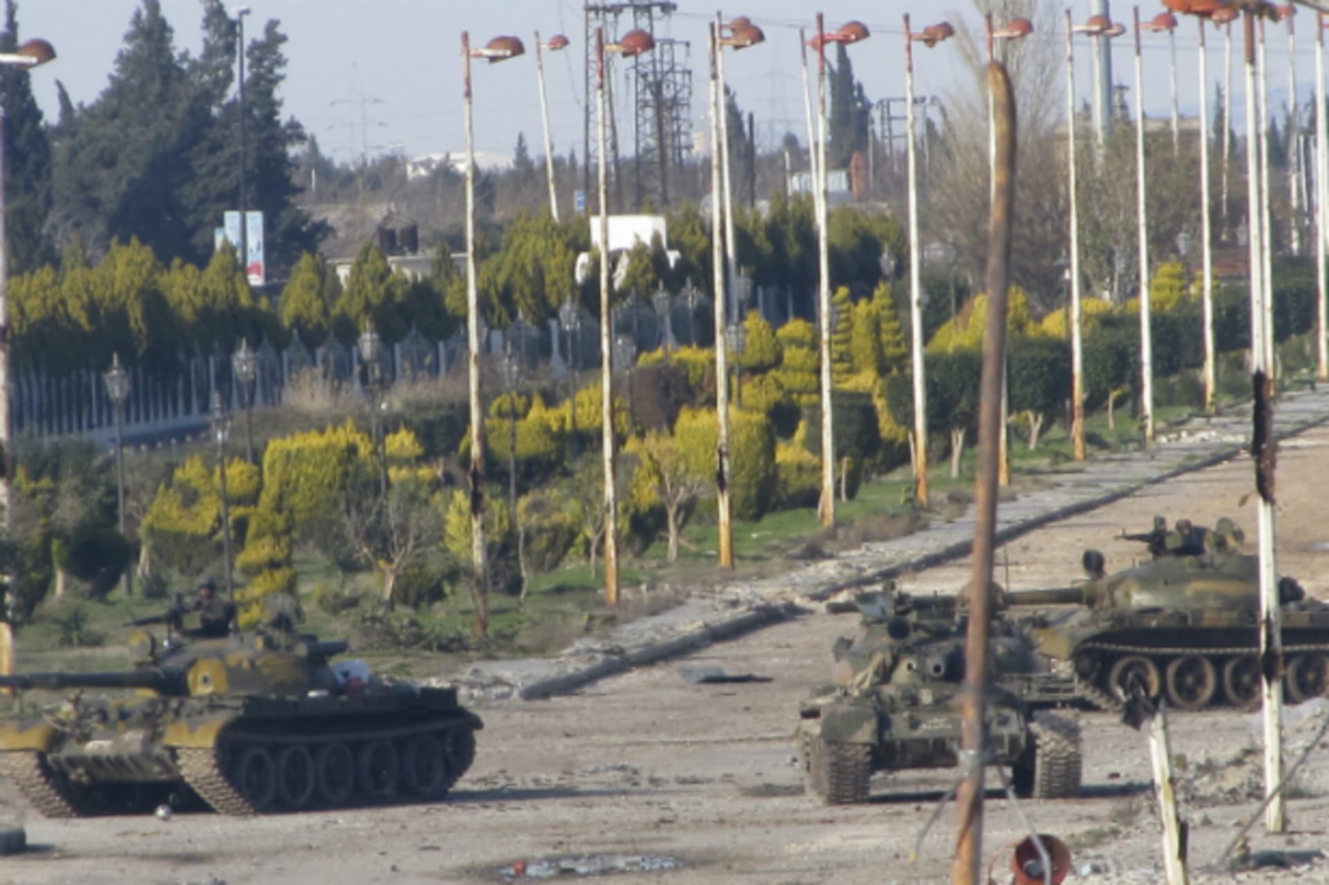 <p>Syrian tanks are seen in Bab Amro near the city of Homs February 12, 2012. Syrian forces resumed their bombardment of the city…m neighbourhoods that have been at the forefront of opposition to President Bashar al-Assad. (Courtesy Mulham Alnader/REUTERS)</p>
