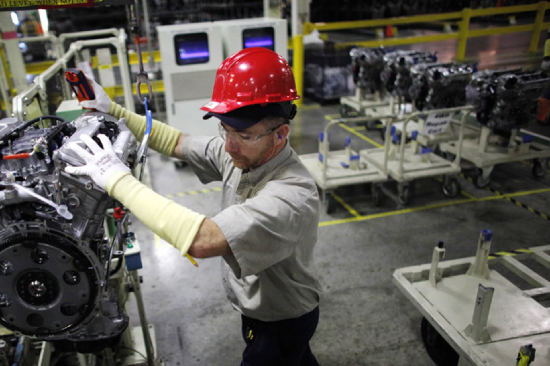 <p>A Toyota automaker employee moves an engine at the Toyota assembly line in Huntsville, Alabama (Carlos Barria/Courtsey Reuters).</p>
