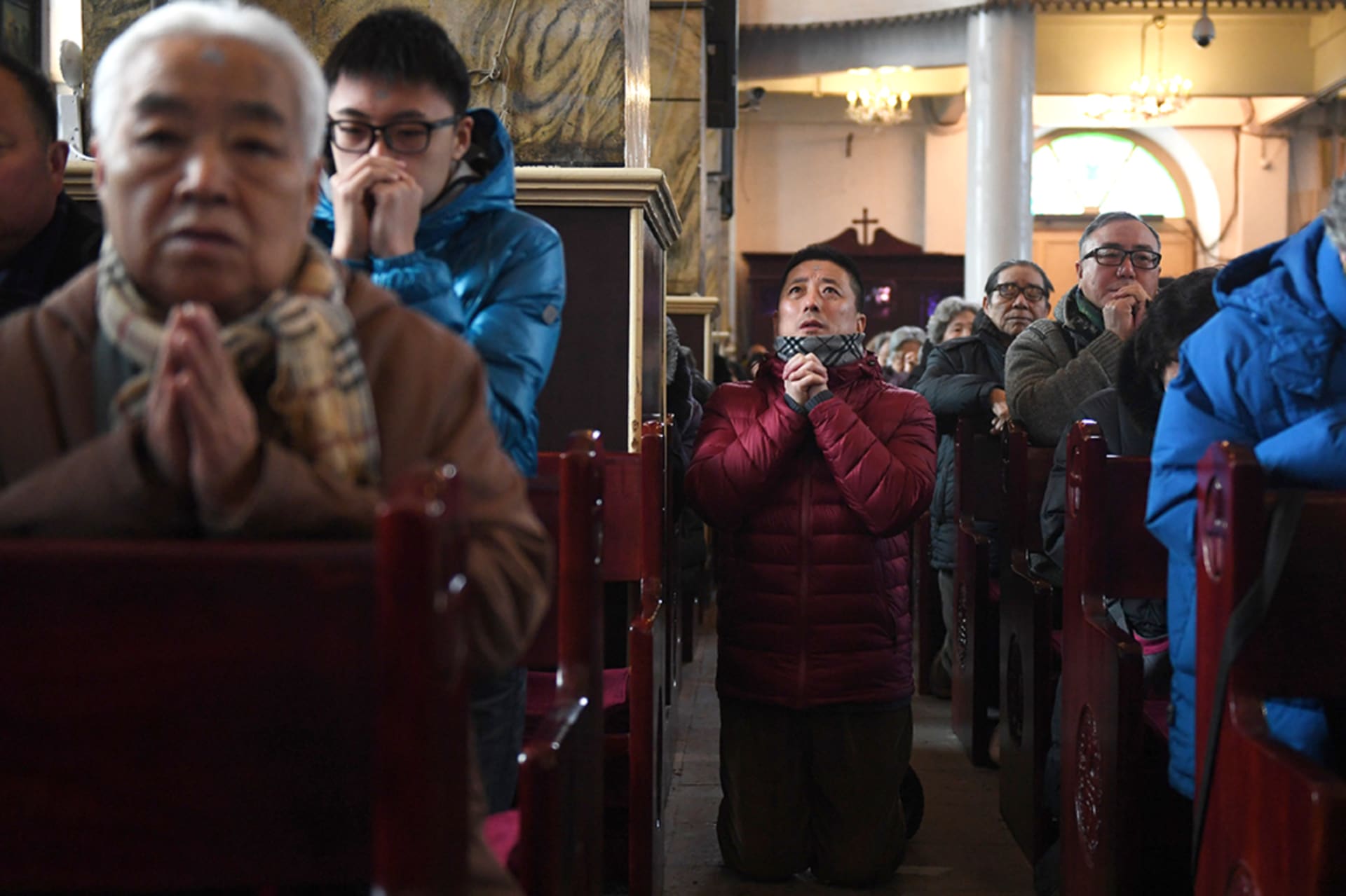 <p>Chinese Catholics attend an Ash Wednesday mass at a state-sanctioned church in Beijing.</p>
