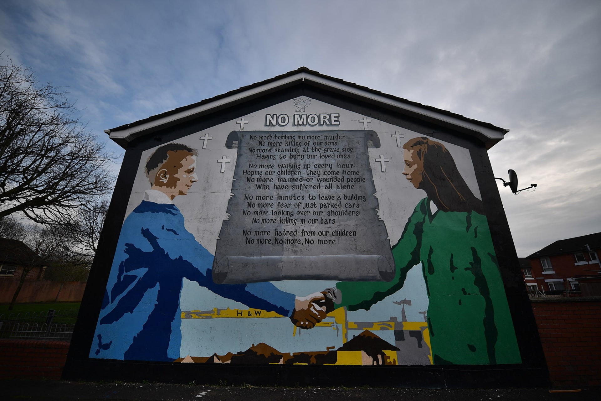 <p>A peace mural adorns a building in a loyalist neighborhood of Belfast.</p>
