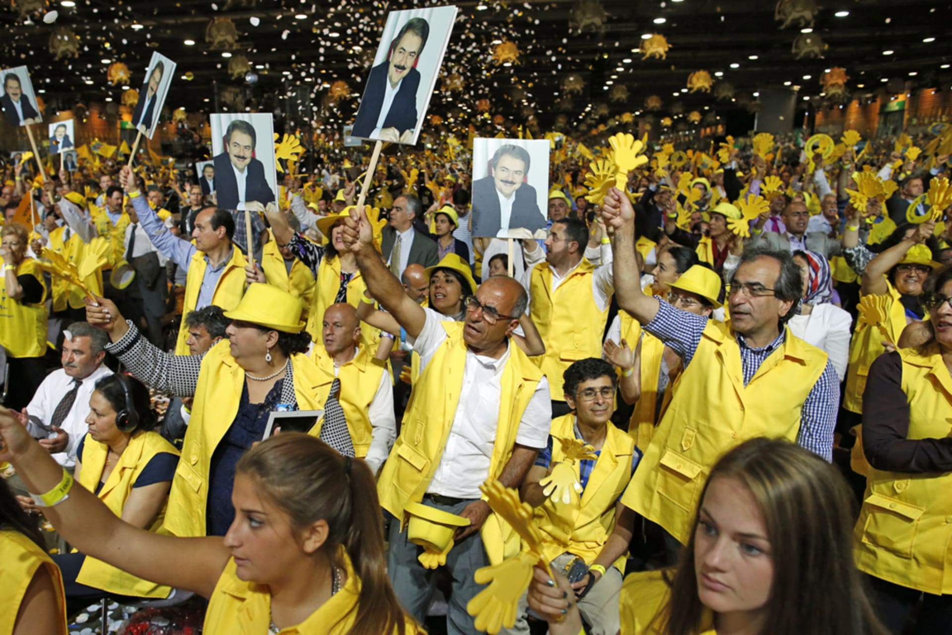 <p>Supporters of Maryam Rajavi, president-elect of the National Council of Resistance of Iran, take part in a rally near Paris, June 2014. </p>
