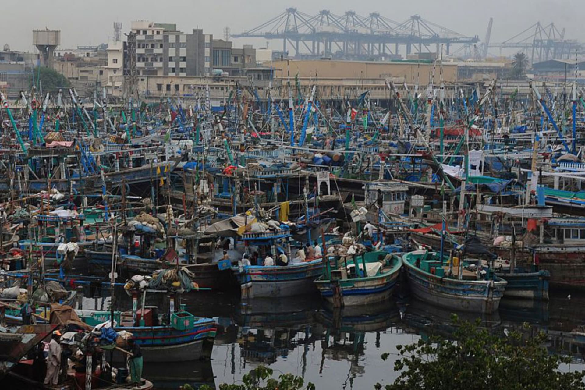 <p>Fishing boats anchored at Karachi Fish Harbor after a severe cyclone warning, October 29, 2014.</p>
