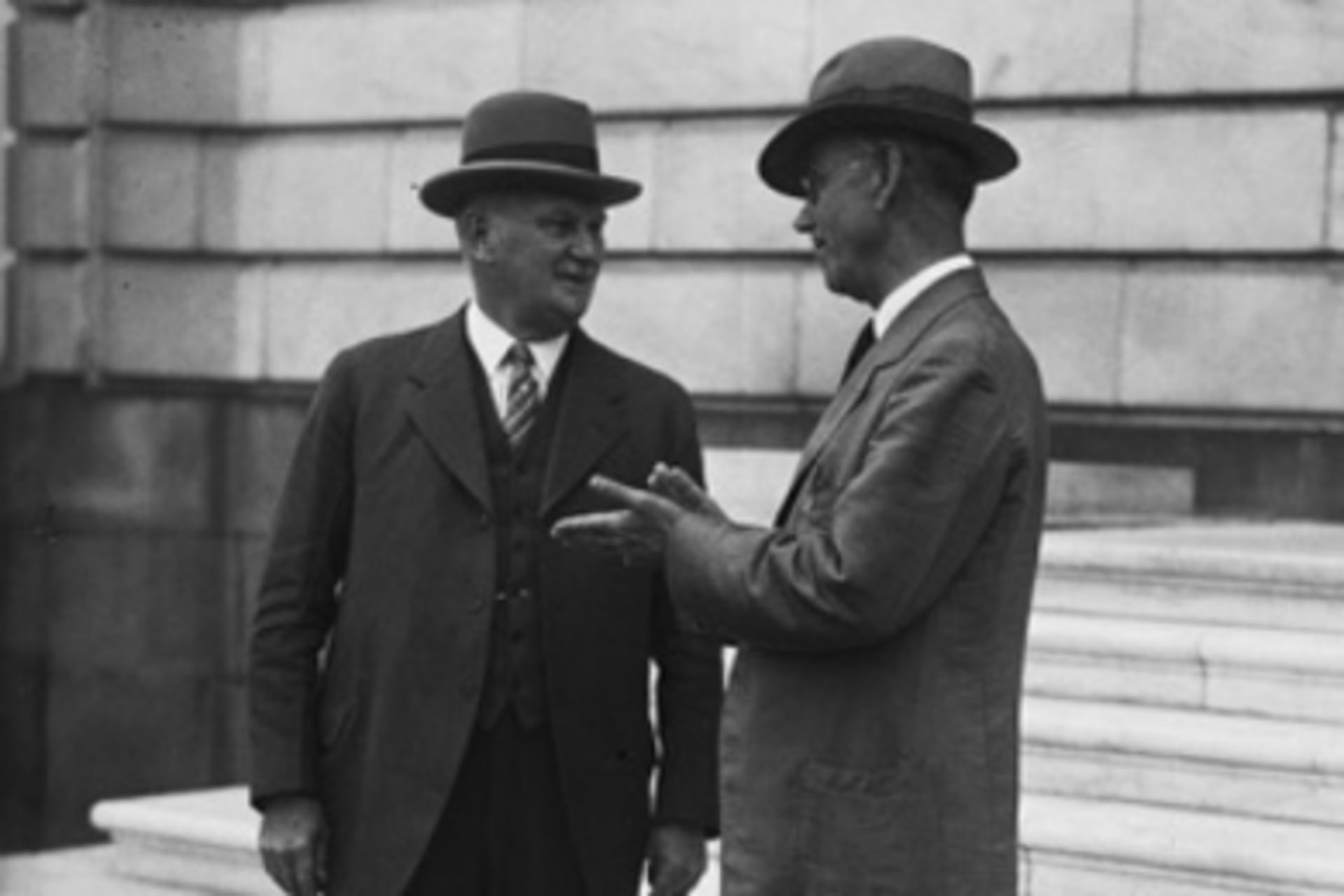 <p>Representative Willis G. Hawley (R-OR) and Senator Reed Smoot (R-UT) on the steps of the Senate office building</p>
