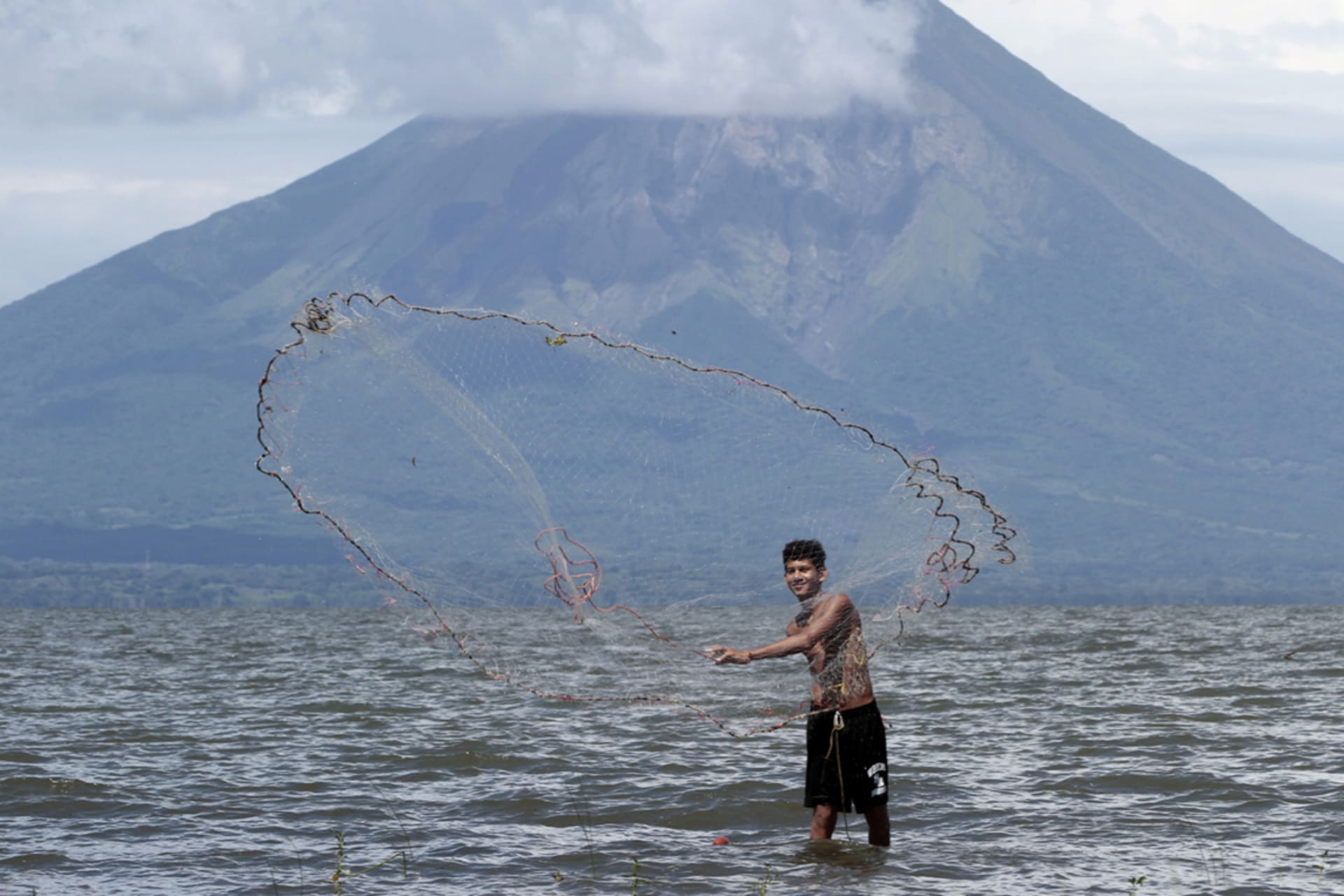 <p>A fisherman casts a fishing net at Lake Cocibolca in Rivas, Nicaragua.</p>
