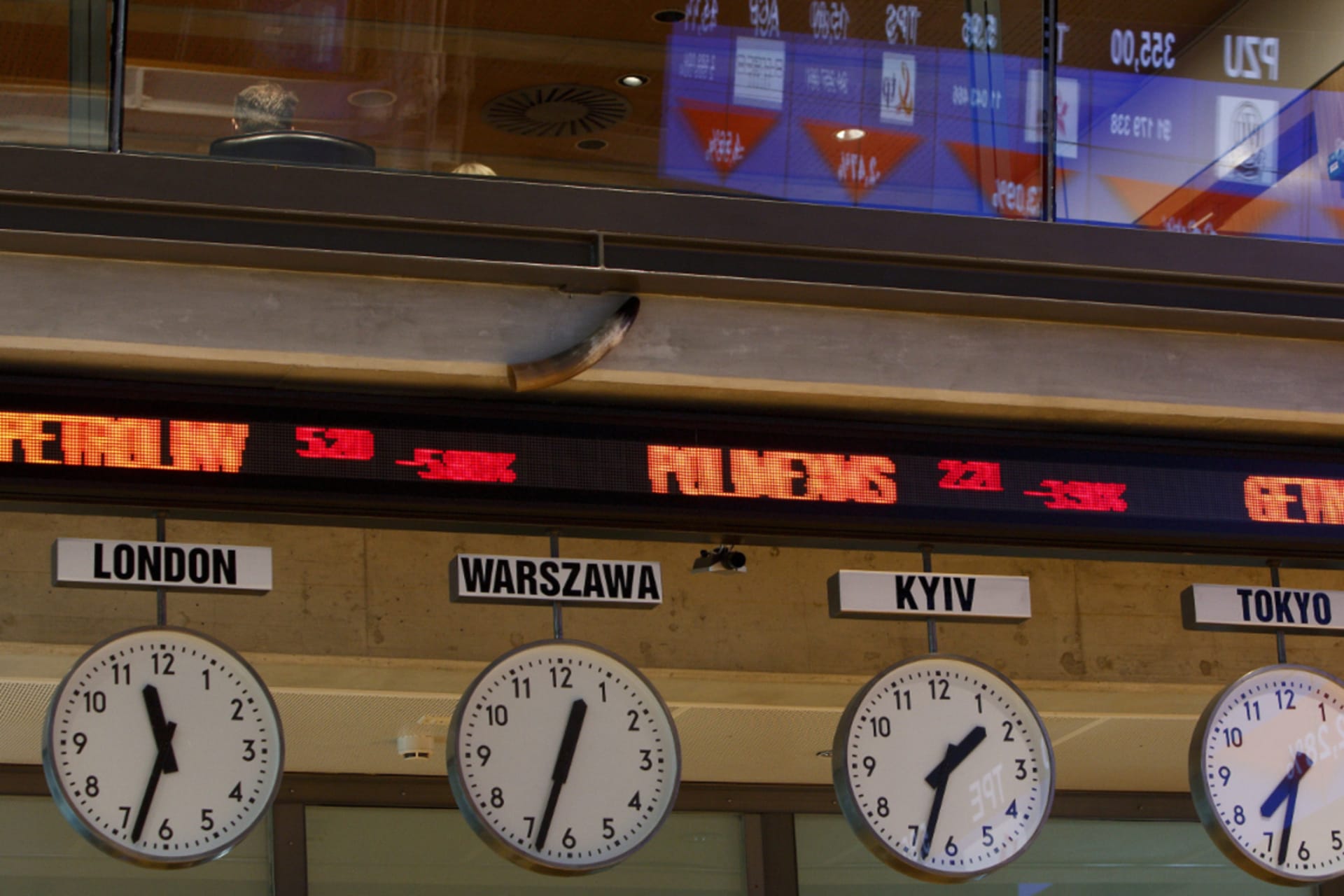 <p>Stock exchange figures are displayed above clocks with time from around the world at Warsaw Stock Exchange.</p>
