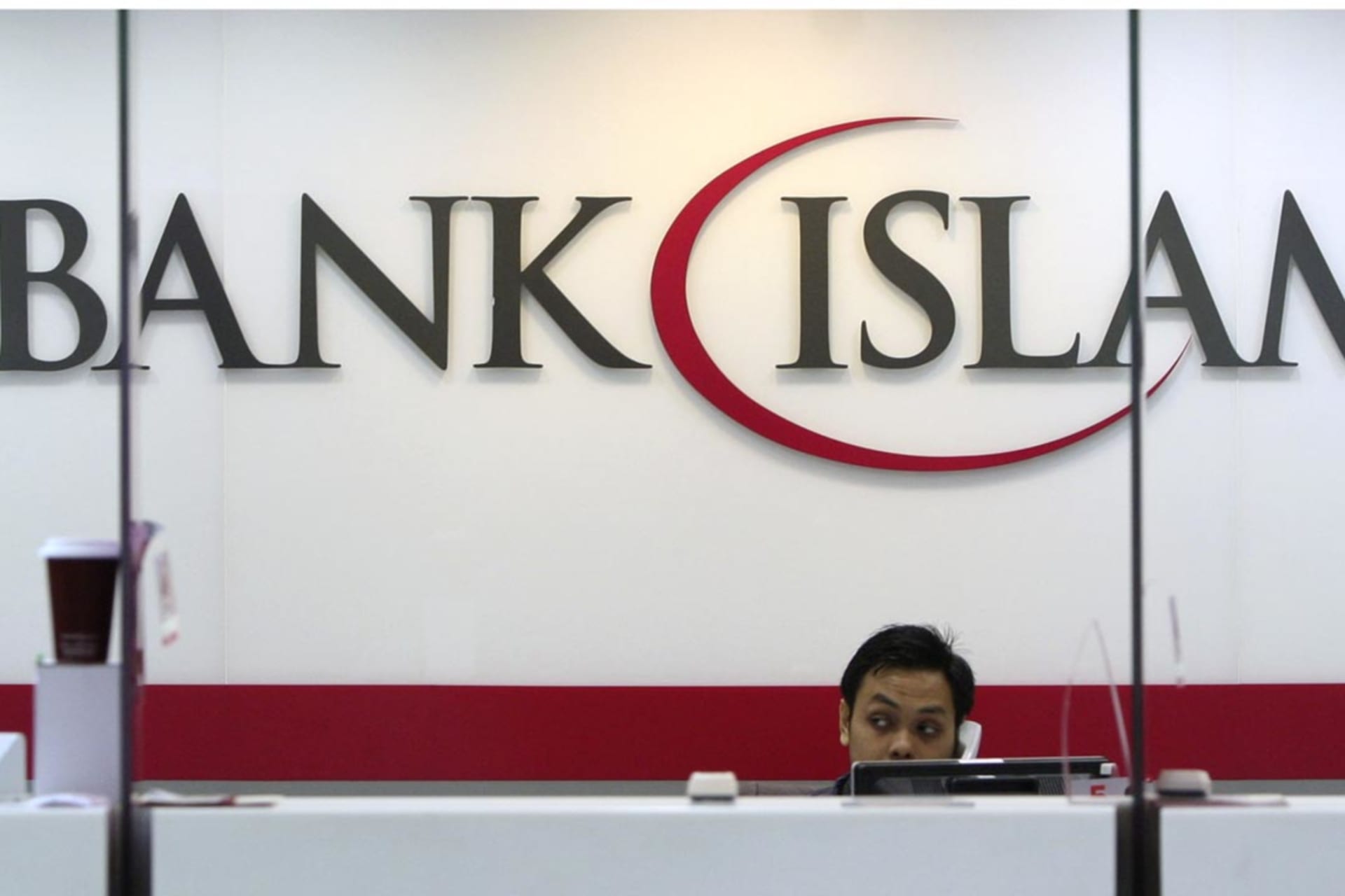 <p>A staffer at the Bank Islam branch office near Kuala Lumpur, Malaysia.</p>