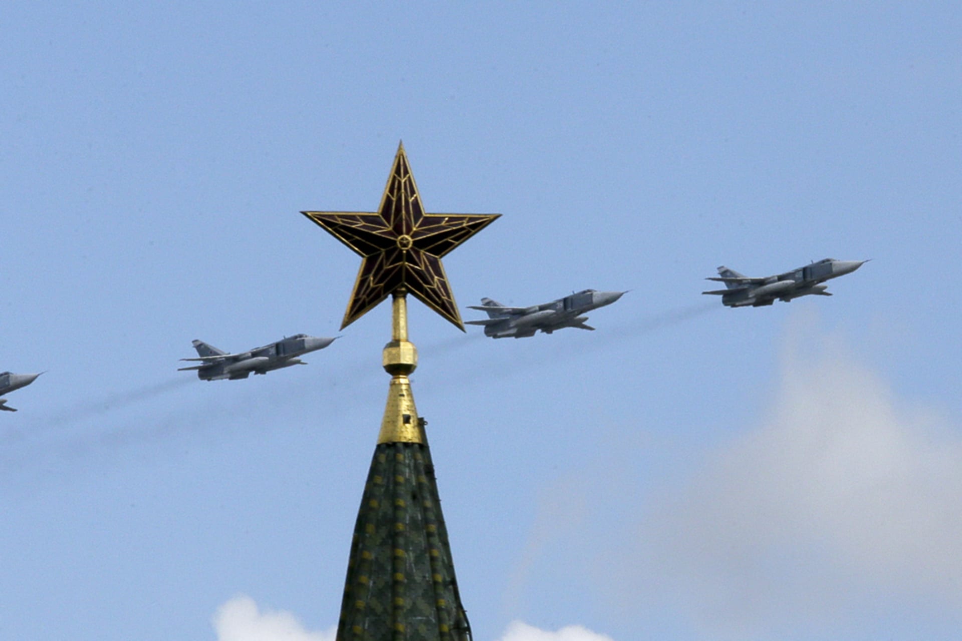 <p>Russian jets fly in formation during rehearsals for the Victory Day military parade, with a tower of the Kremlin seen in the foreground, May 3, 2014.</p>

