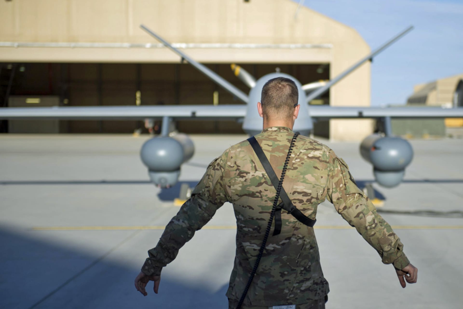 <p>A U.S. airman conducts preflight checks on an MQ-9 Reaper in Afghanistan, 2015.</p>