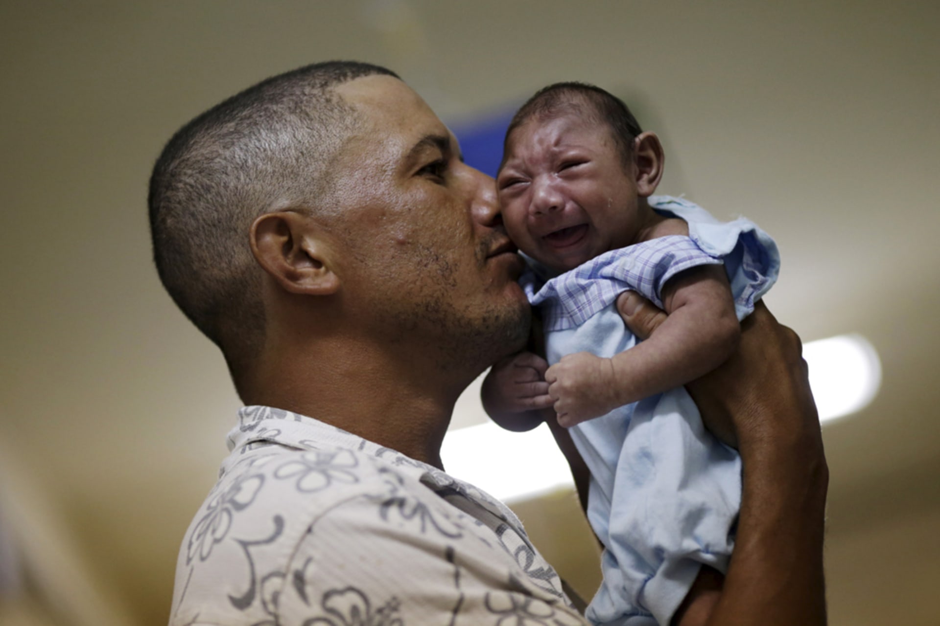 <p>Geovane Silva holds his son Gustavo Henrique, who has microcephaly, at the Oswaldo Cruz Hospital in Recife, Brazil.</p>
