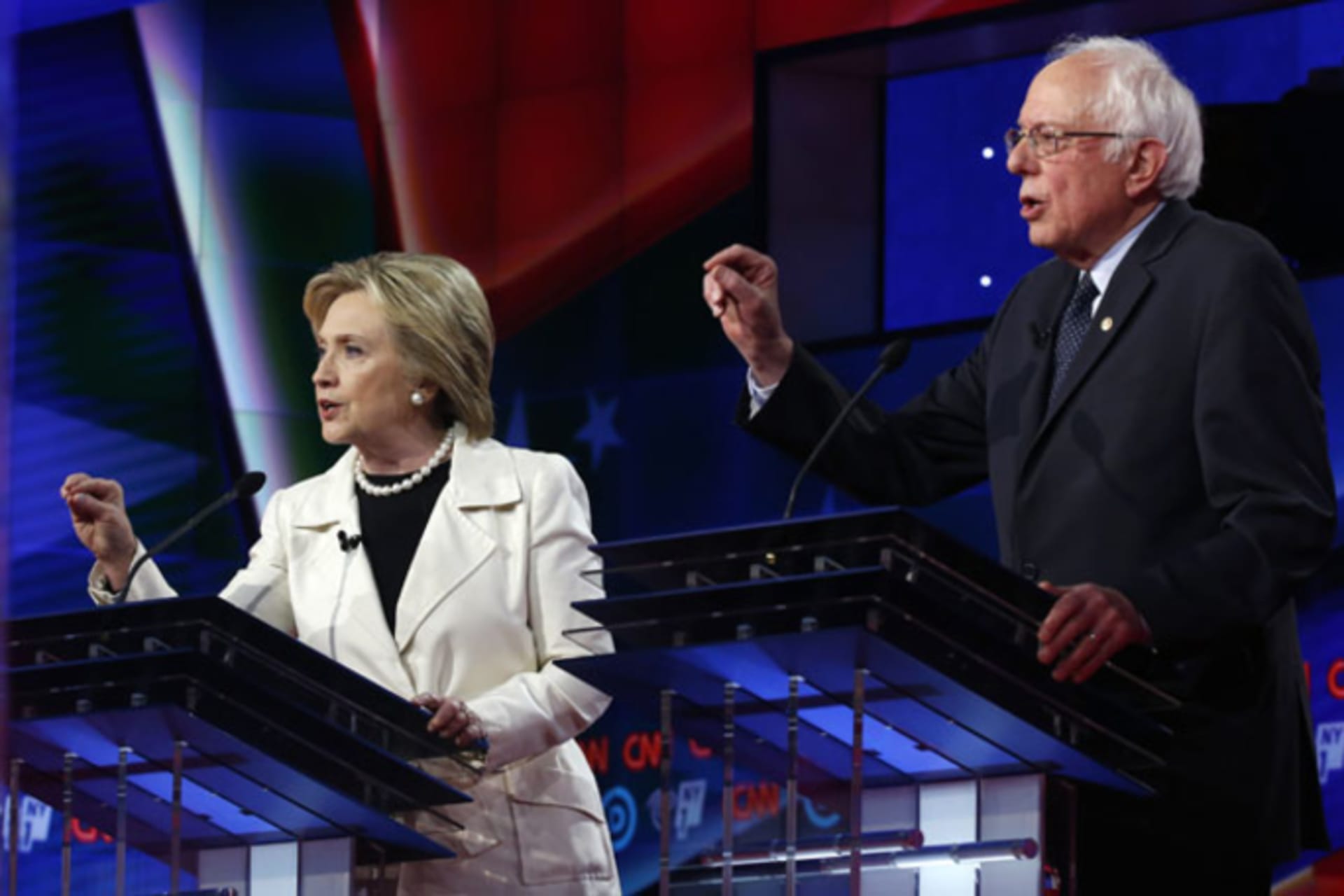 <p>Hillary Clinton and Senator Bernie Sanders speak simultaneously during a Democratic debate in New York on April 14, 2016.</p>
