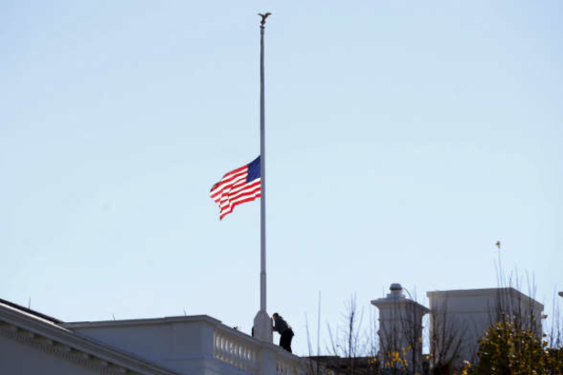 <p>The flag over the White House is lowered to half staff to honor the victims of the San Bernardino, California shootings. (Kevin Lamarque/Courtesy Reuters)</p>

