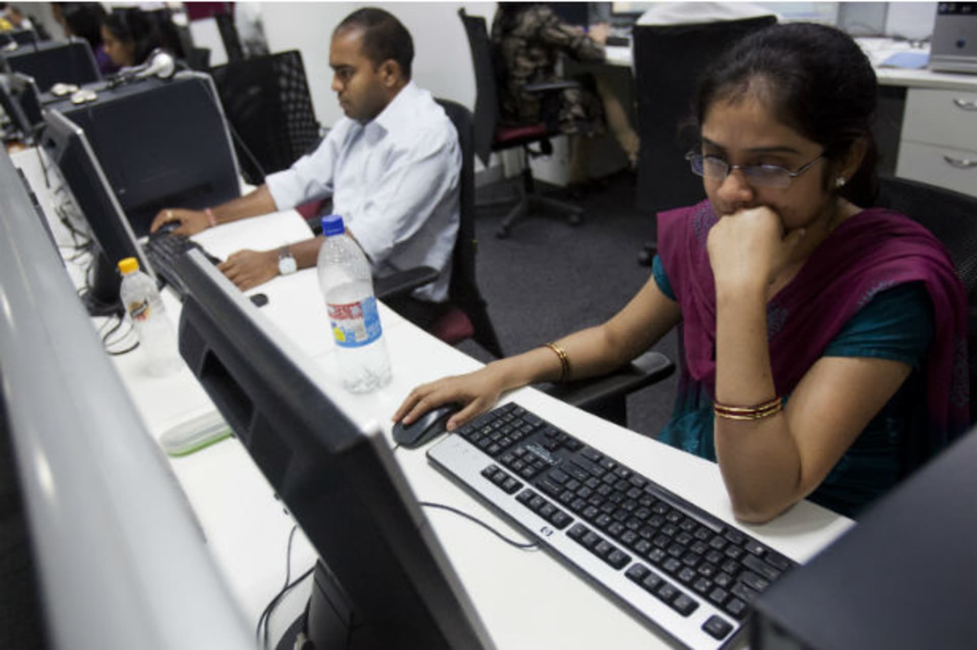 <p>Workers are seen at their workstations on the floor of an outsourcing centre in Bangalore, February 29, 2012. (Vivek Prakash / Courtesy Reuters)</p>
