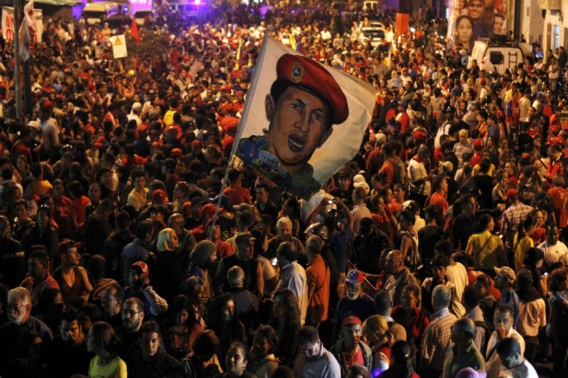<p>Supporters of Venezuela’s president Hugo Chavez react to the announcement of his death outside the hospital where he was being treated, in Caracas March 5, 2013.</p>