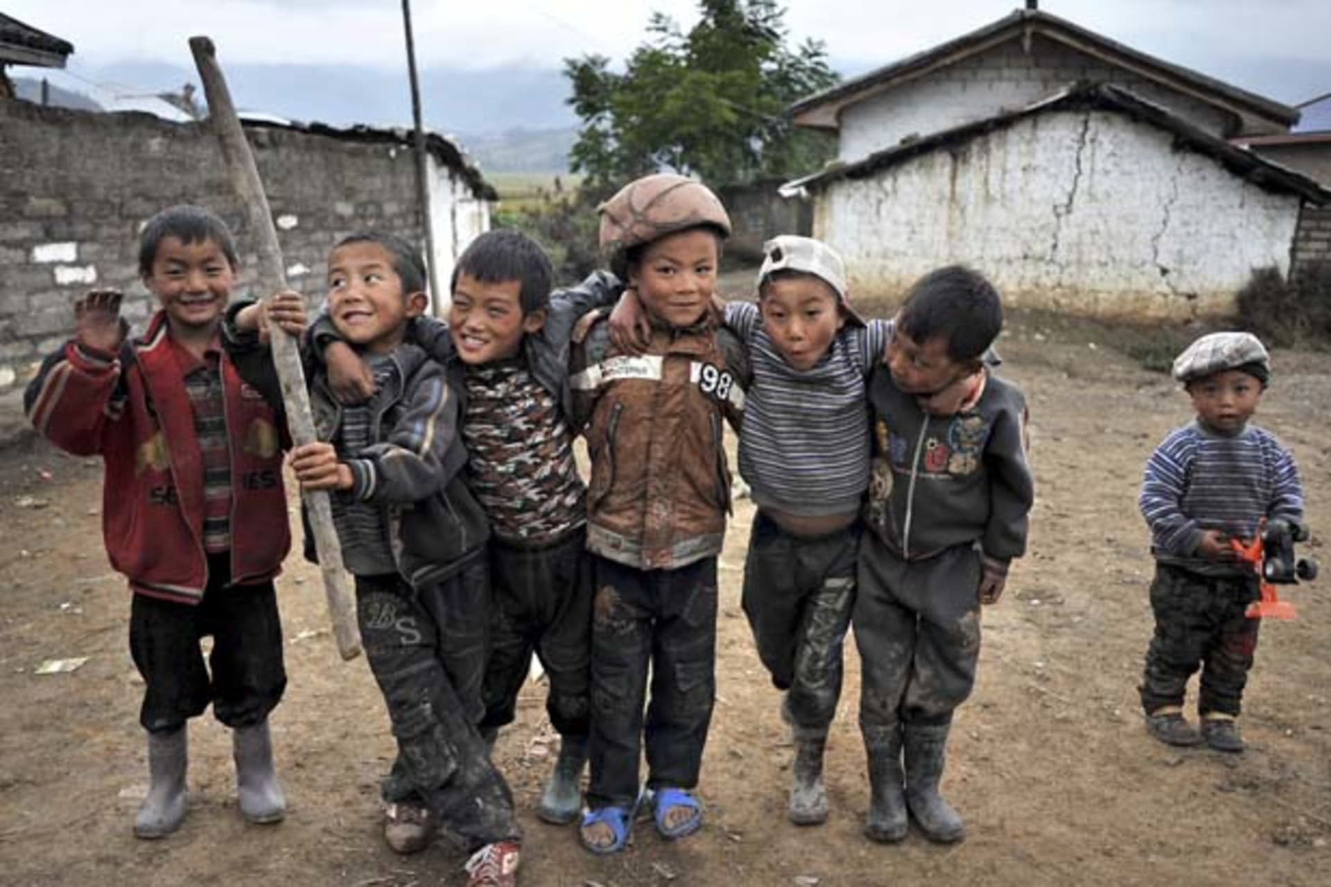Yi ethnic minority children play near their houses at Zhaojue county of Liangshan Yi Autonomous Prefecture,