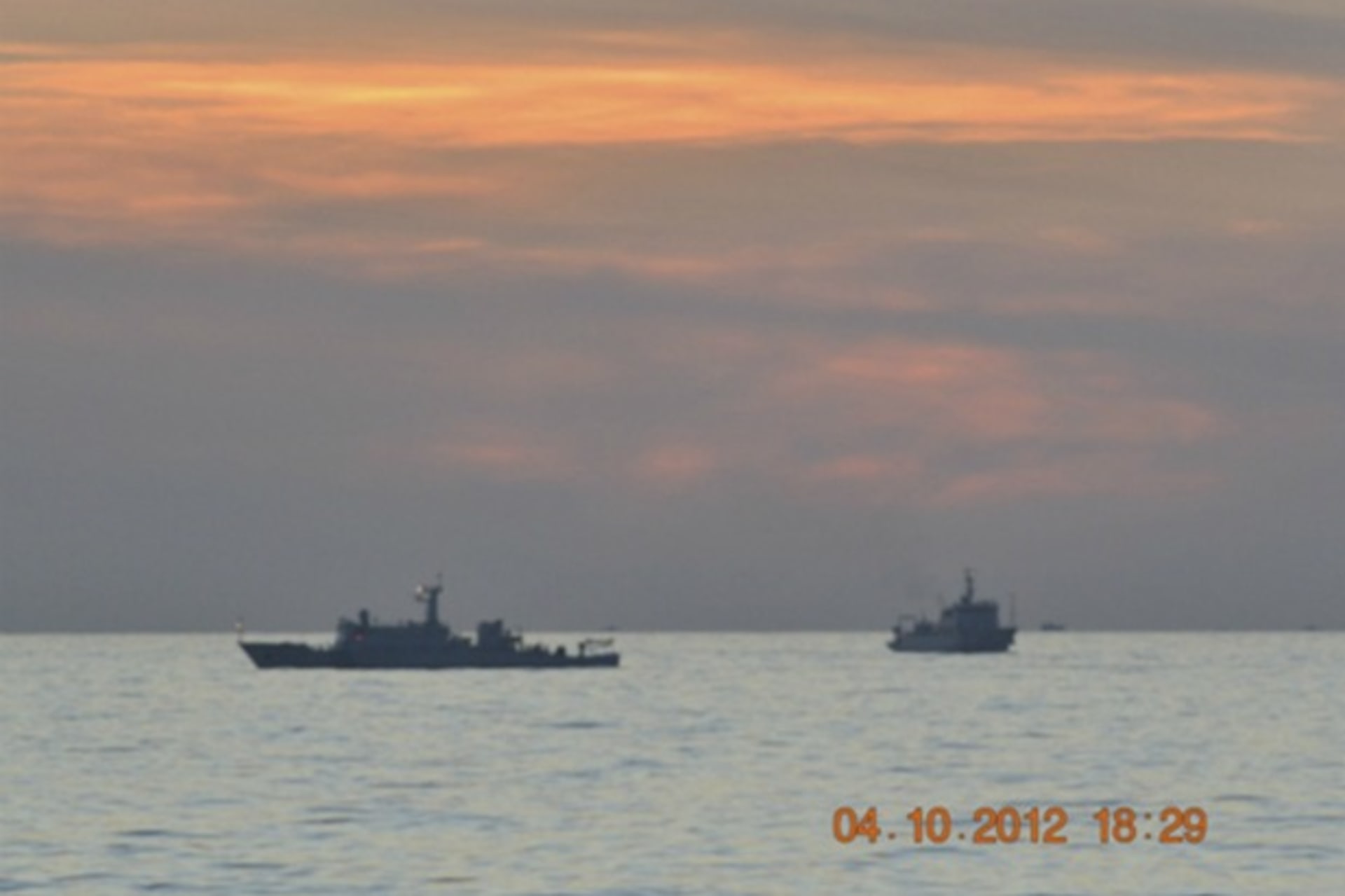 <p>A handout photo of two Chinese surveillance ships which sailed between a Philippines warship and eight Chinese fishing boats t…men in the Scarborough Shoal, in the South China Sea, about 124 nautical miles off the main island of Luzon on April 10, 2012.</p>
