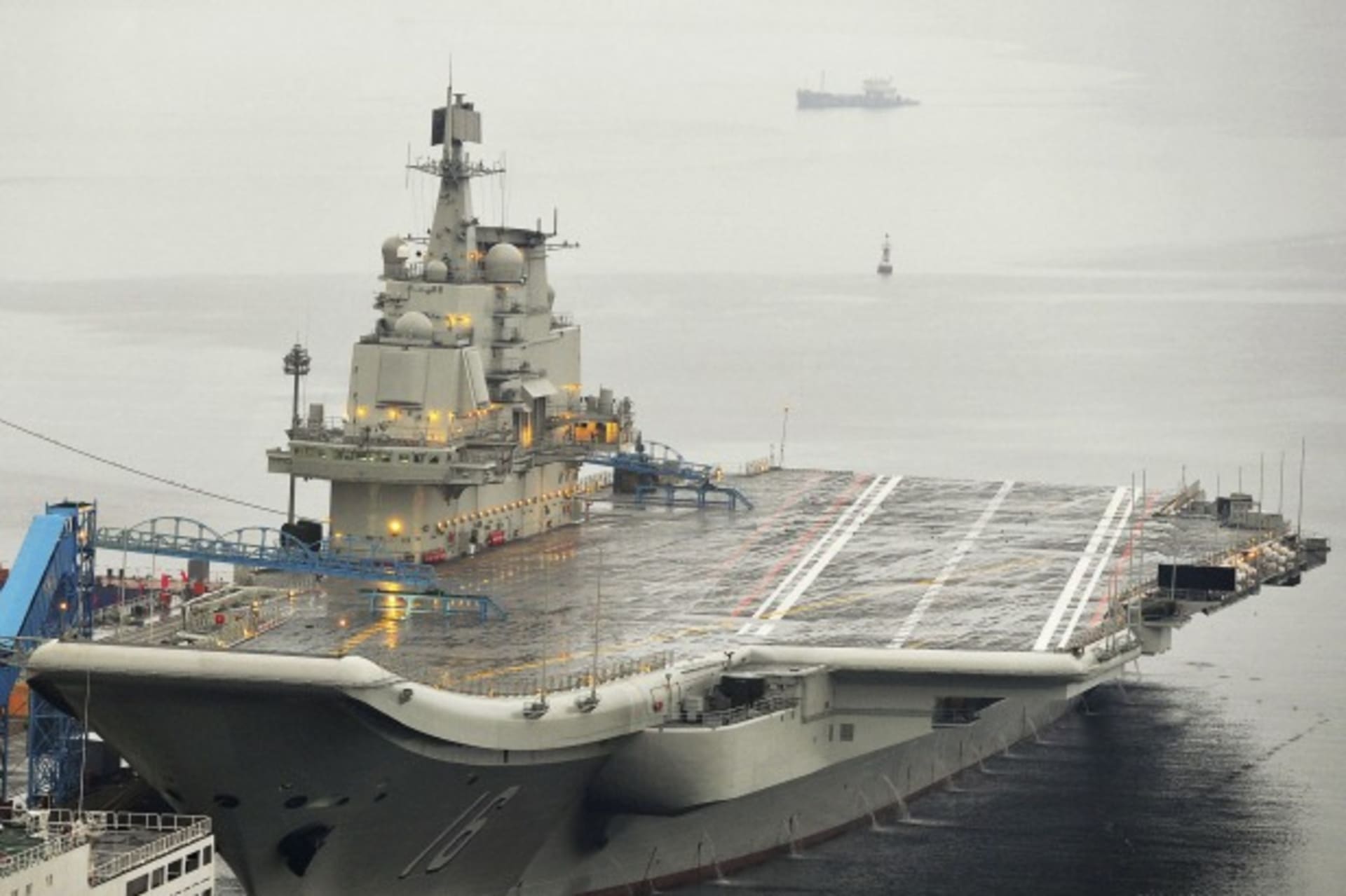 <p>China’s first aircraft carrier, the Liaoning, is seen docked at Dalian Port, in Dalian, China, on September 23, 2012.</p>
