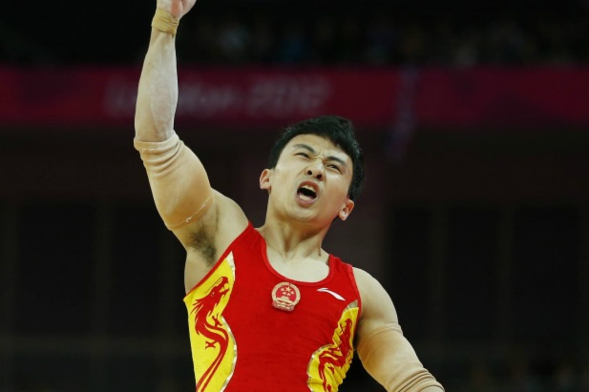 <p>China’s Feng Zhe, the eventual gold medal winner, reacts after competing in the men’s gymnastics parallel bars final during the London 2012 Olympic Games on August 7, 2012.</p>