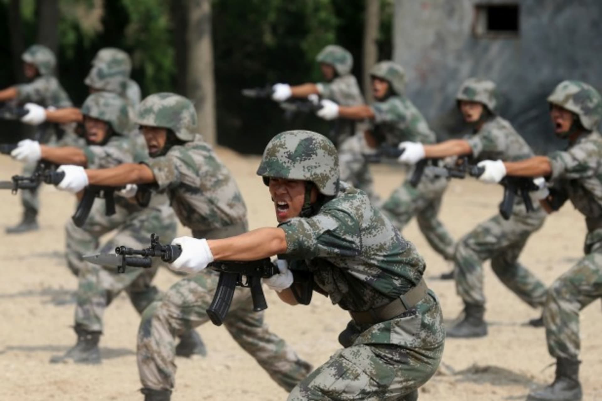 <p>Members of People’s Liberation Army (PLA) coastal defence force shout as they practise during a drill to mark the upcoming 87t… 29, 2014. REUTERS/Stringer (CHINA – Tags: MILITARY POLITICS ANNIVERSARY) CHINA OUT. NO COMMERCIAL OR EDITORIAL SALES IN CHINA</p>
