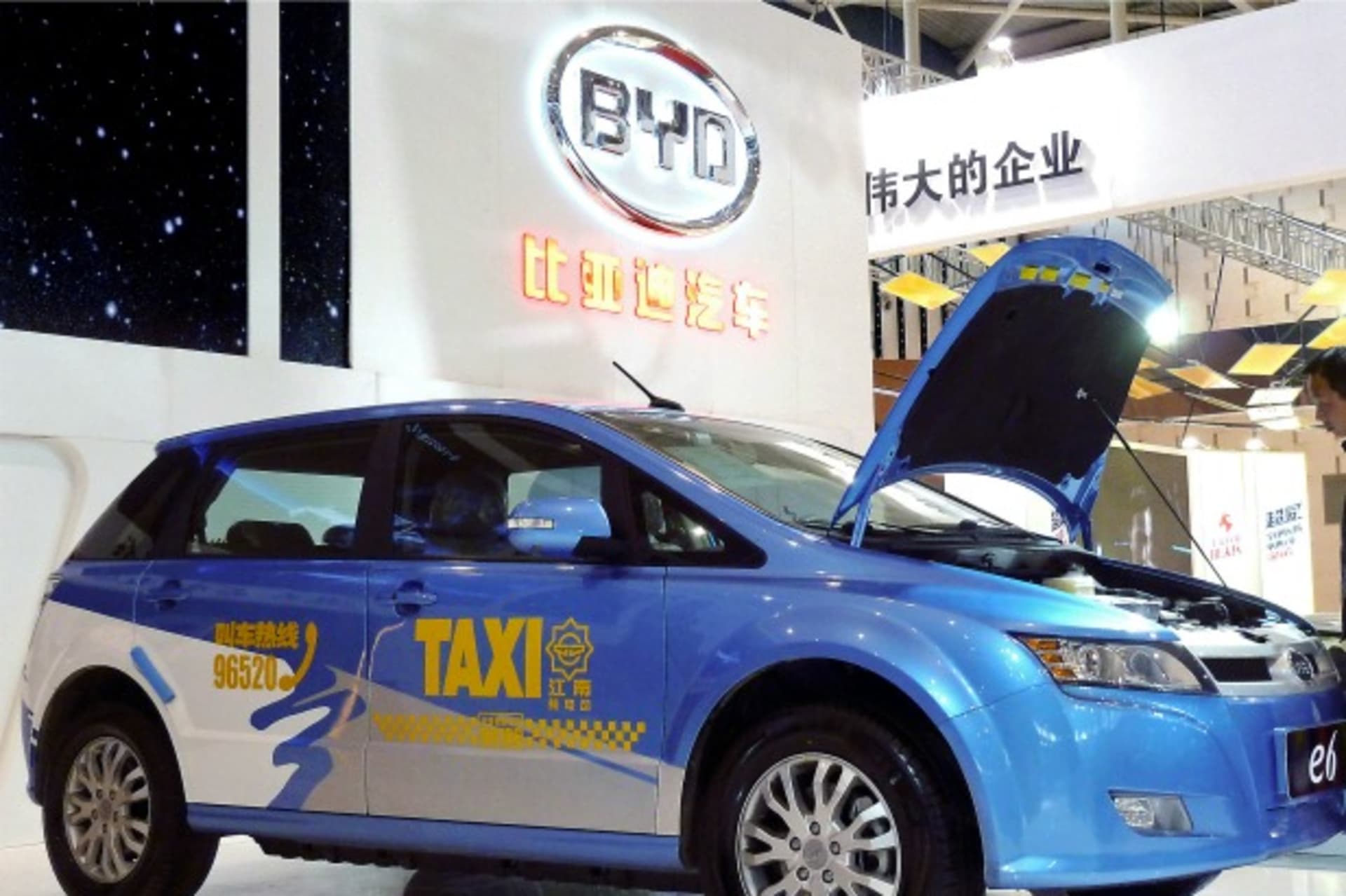 <p>A visitor looks at BYD E6 electric car on display at the New Energy Auto Expo in Nanjing, Jiangsu province March 22, 2014. Thr… in January demonstrated the importance of green cars by visiting a factory of BYD Co Ltd , maker of the e6 pure electric car.</p>