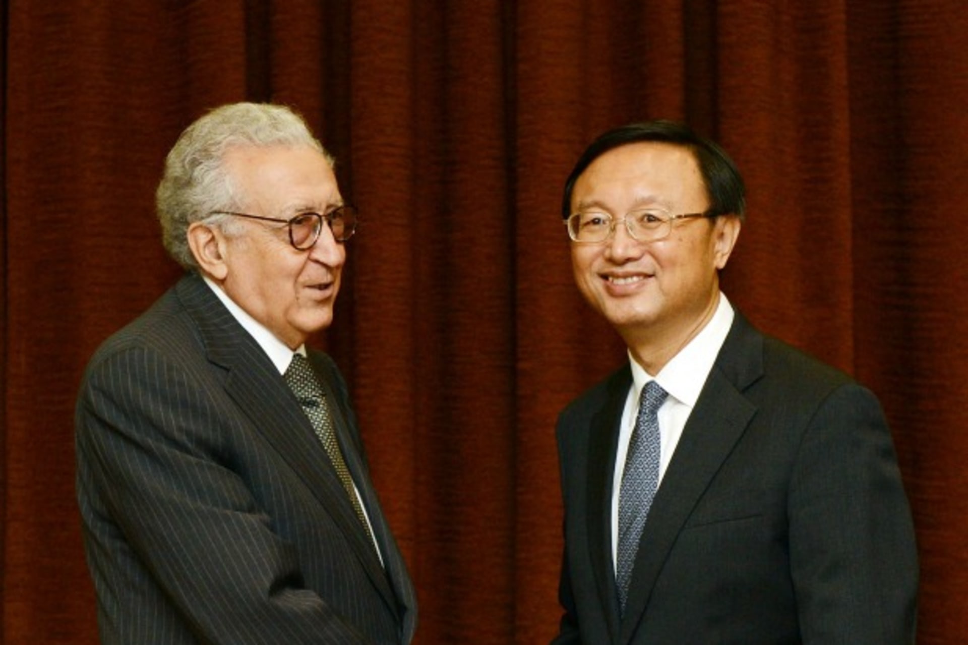 <p>U.N.-Arab League peace envoy for Syria Lakhdar Brahimi shakes hands with Chinese Foreign Minister Yang Jiechi before their meeting at the Ministry of Foreign Affairs in Beijing on October 31, 2012.</p>

