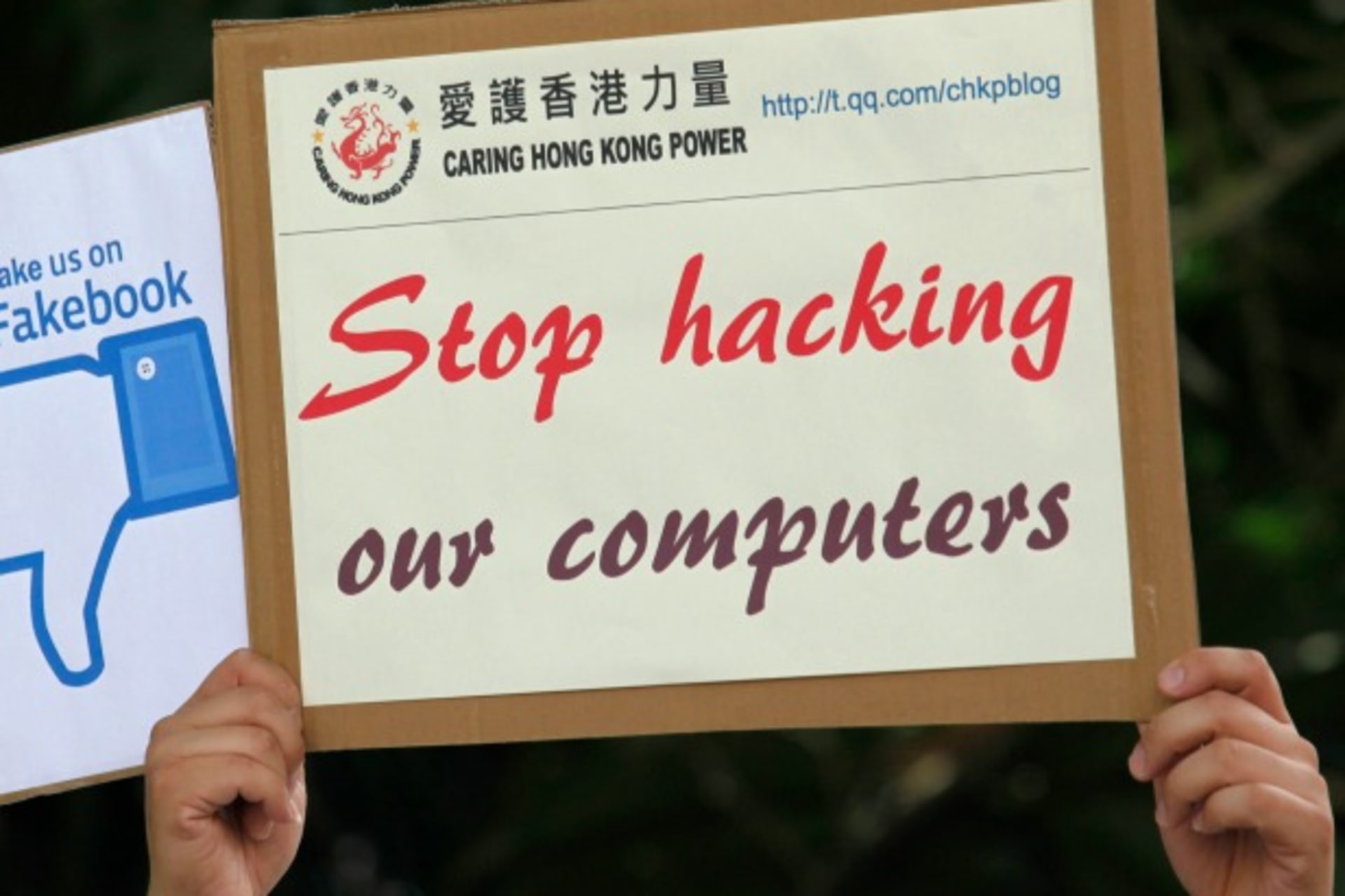 <p>A demonstrator from the pro-China “Caring Hong Kong Power” group protests over claims from former U.S. spy agency contractor E…cked computers in the Chinese territory, outside the U.S. Consulate in Hong Kong July on 9, 2013. (Bobby Yip/Courtesy Reuters)</p>
