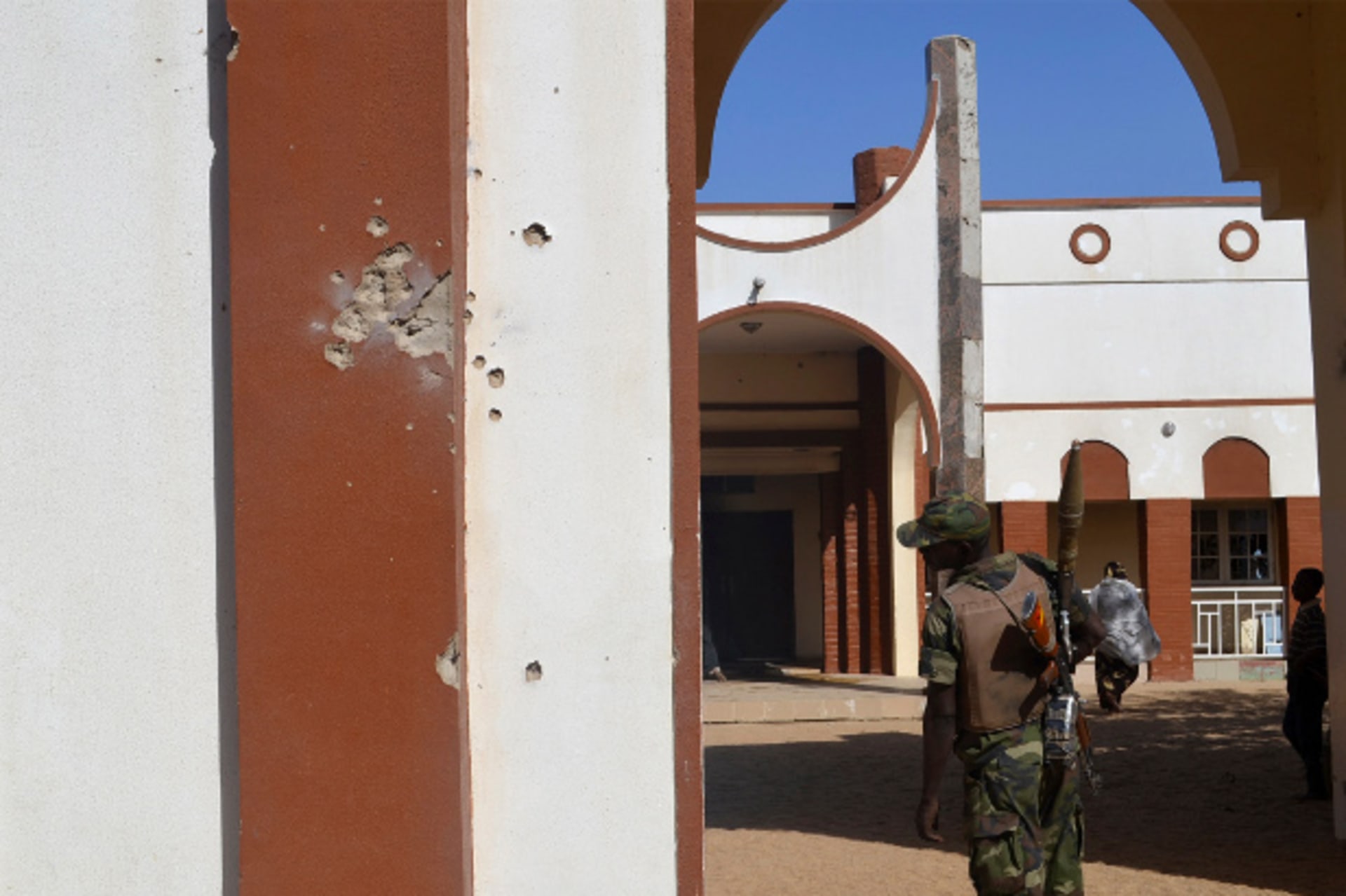 Africa - soldier eyeing bullet wall