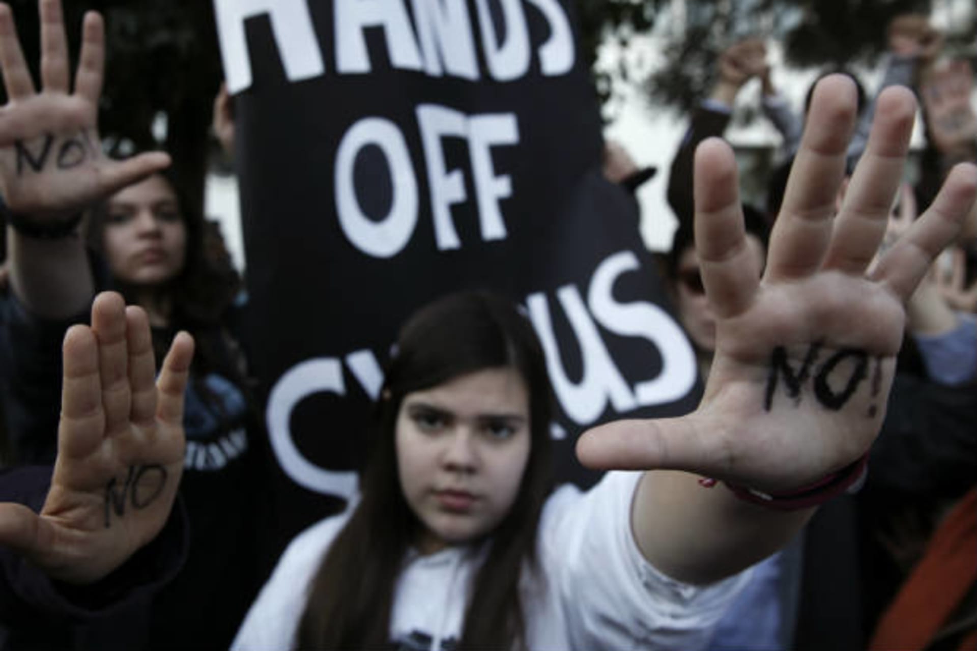 <p>Cypriots protest the plan to seize money from depositors as a part of a bailout package.</p>
