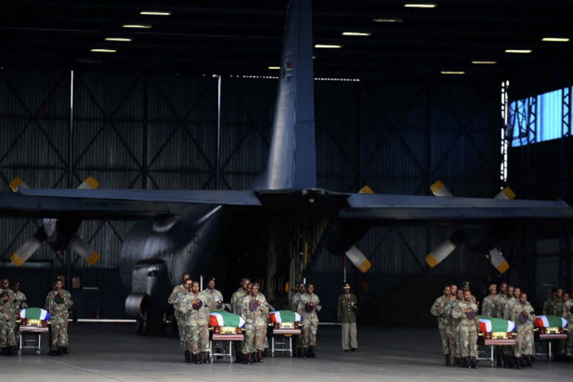 Members of the South Africa National Defence Force (SANDF) carry the mortal remains of 13 members that were killed in Central African Republic (CAR) during the handing over to the respective families at the Waterkloof Air Force Base, in Pretori