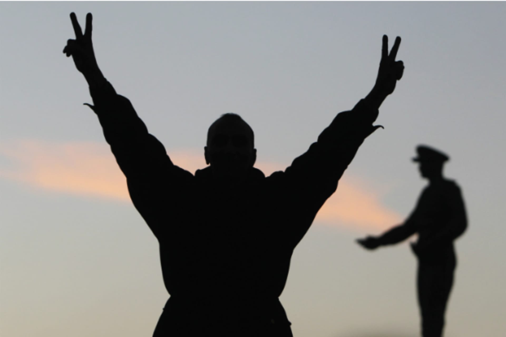 <p>A supporter of the constitution gestures in front of a statue of Egypt’s former Army Chief of Staff Abdel Moneim Riad near Tah…final stage of a referendum on Egypt’s new constitution in Cairo on January 15, 2014. (Mohamed Abd El Ghany/ Courtesy Reuters)</p>
