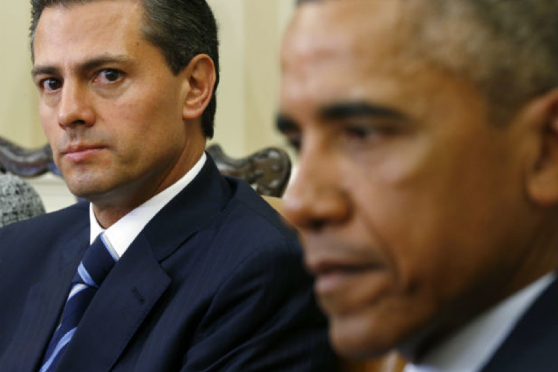 <p>Mexican President Enrique Peña Nieto looks toward U.S. President Barack Obama during their meeting at the White House in Washington, DC, on January 6, 2015.</p>