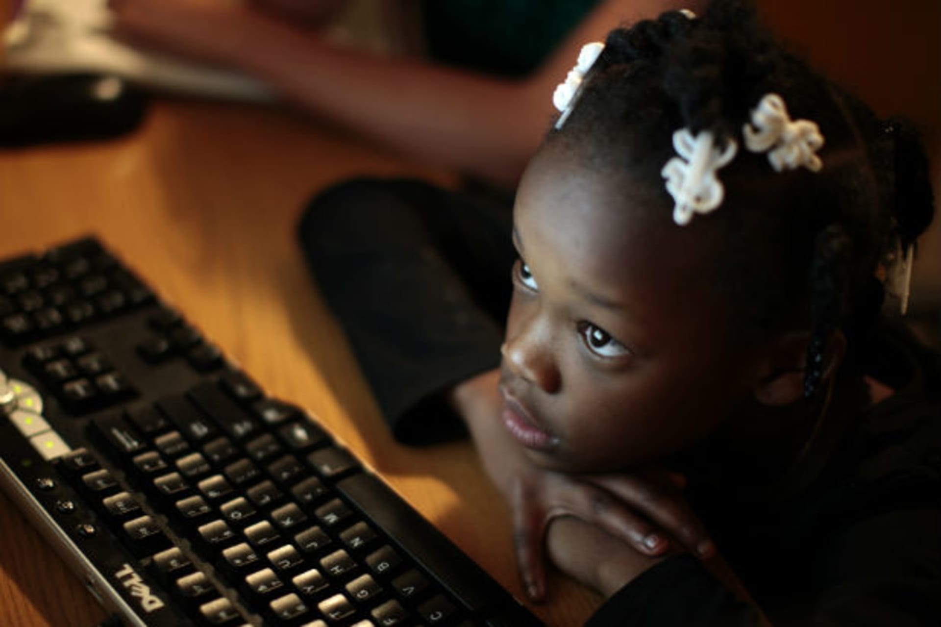 <p>A schoolgirl studies on a computer in Los Angeles, California, on February 9, 2011.</p>
