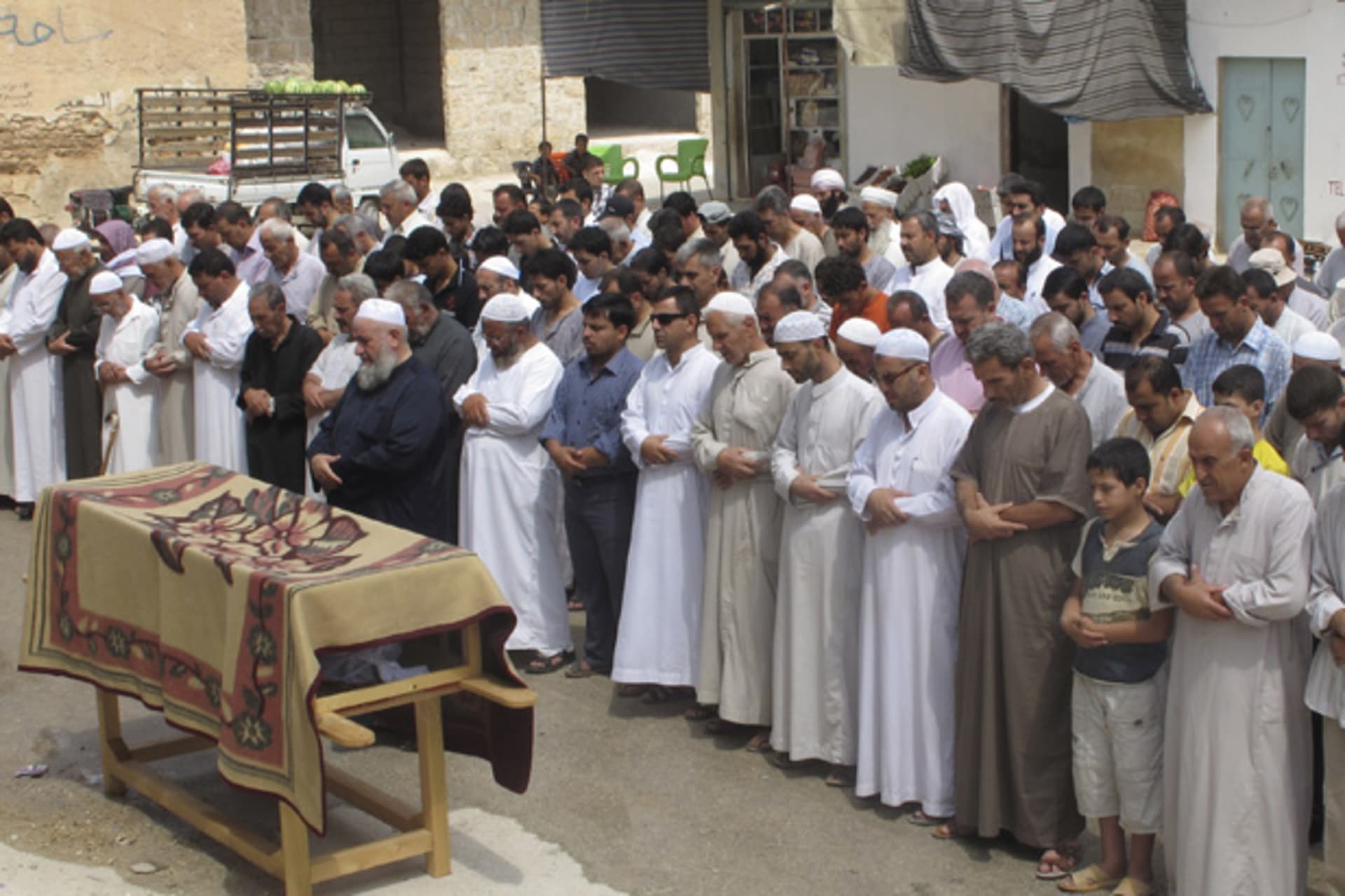 Residents attend the funeral of a sergeant whom defected to join the Free Syrian Army on the outskirts of Idlib province